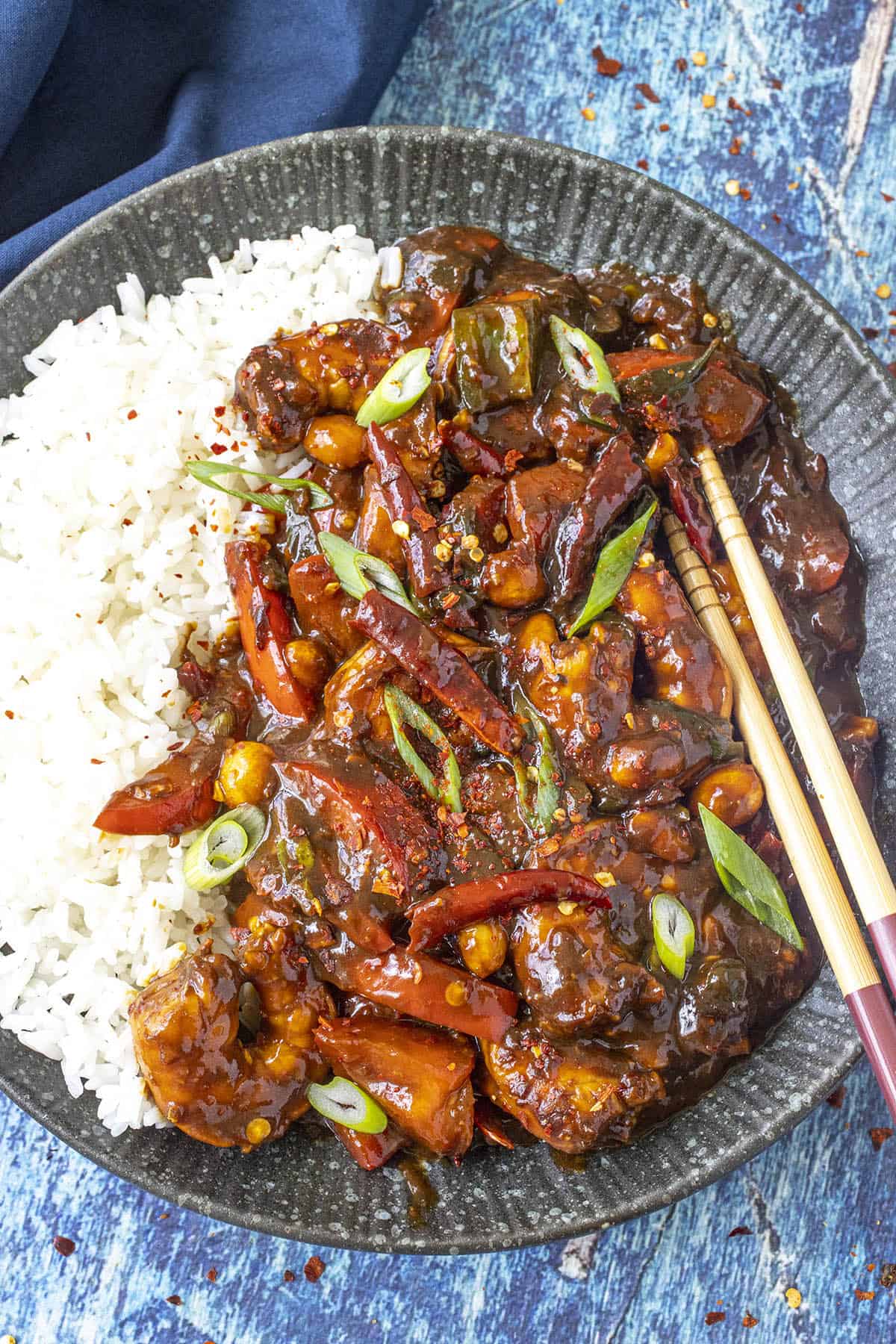 Kung Pao Shrimp served on a plate over white rice