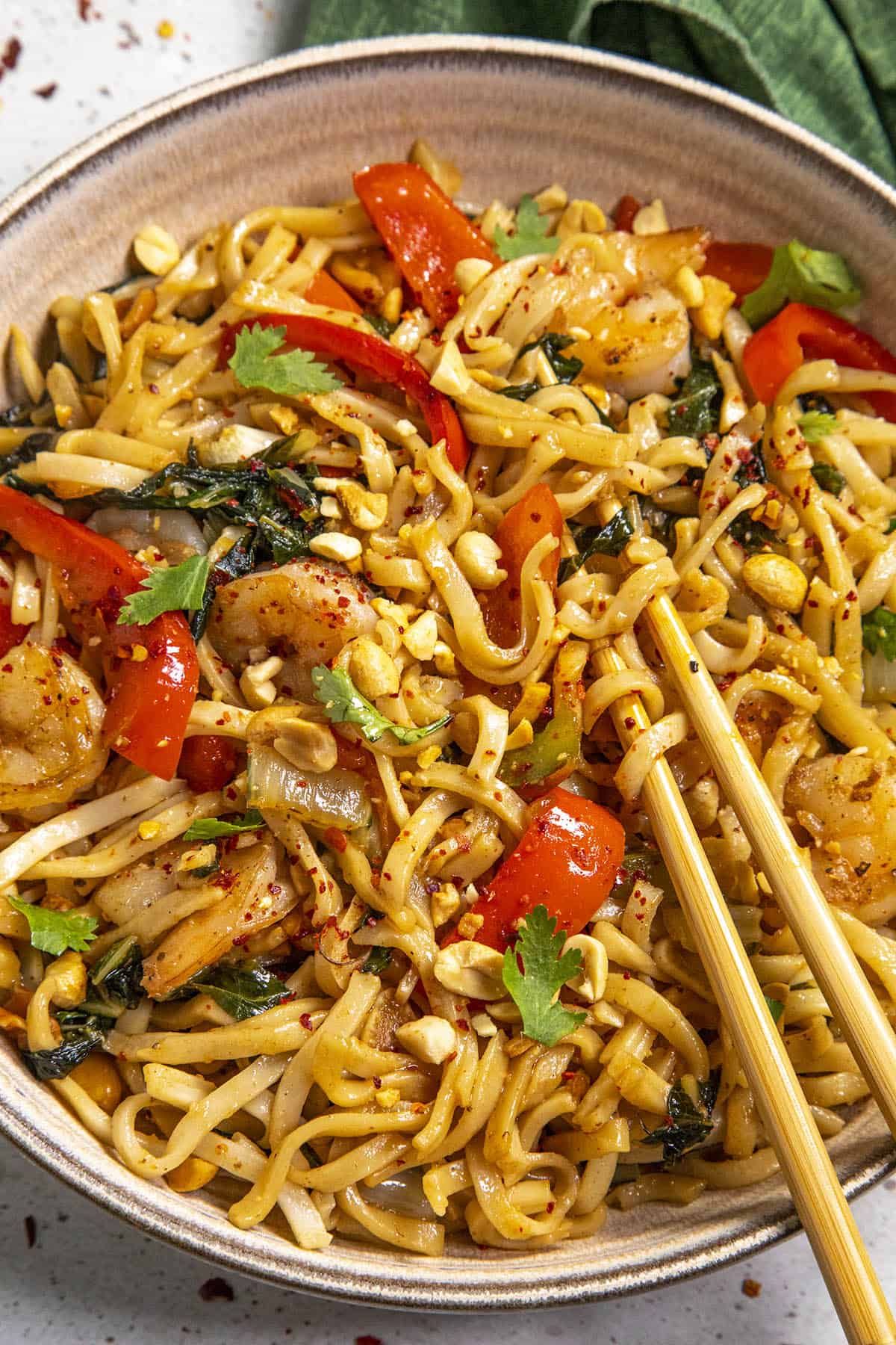 Spicy Thai Noodles in a bowl with chopsticks