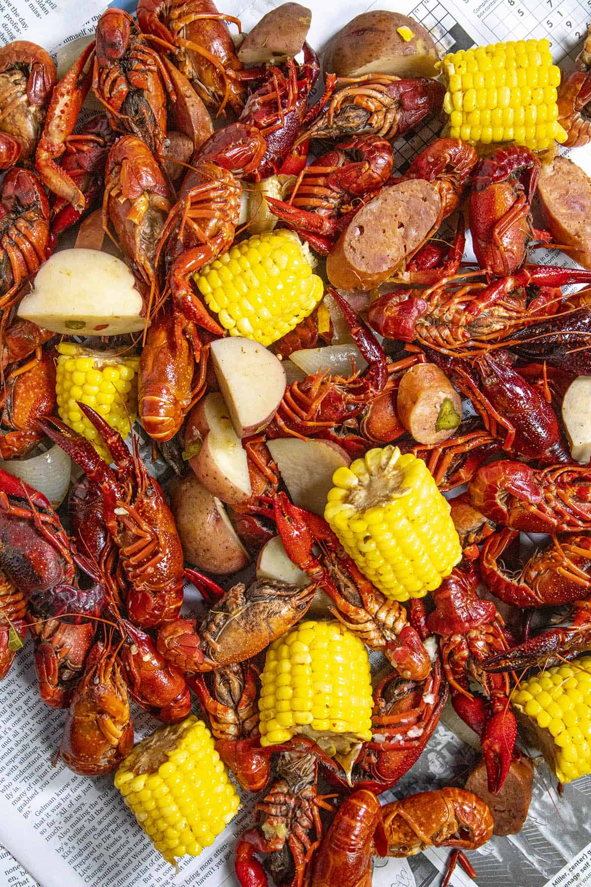 Serving up a large Crawfish Boil on a newspaper lined table