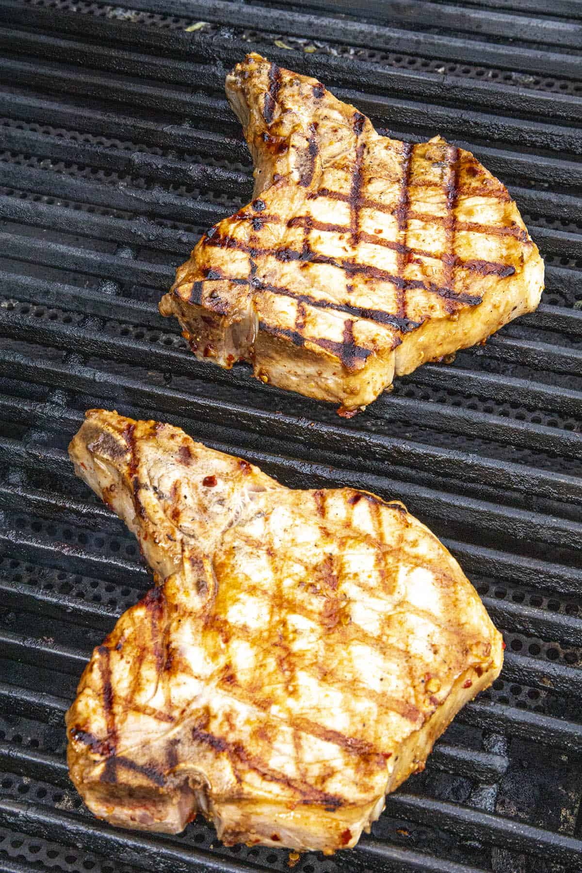 Grilling up marinated pork chops on the grill