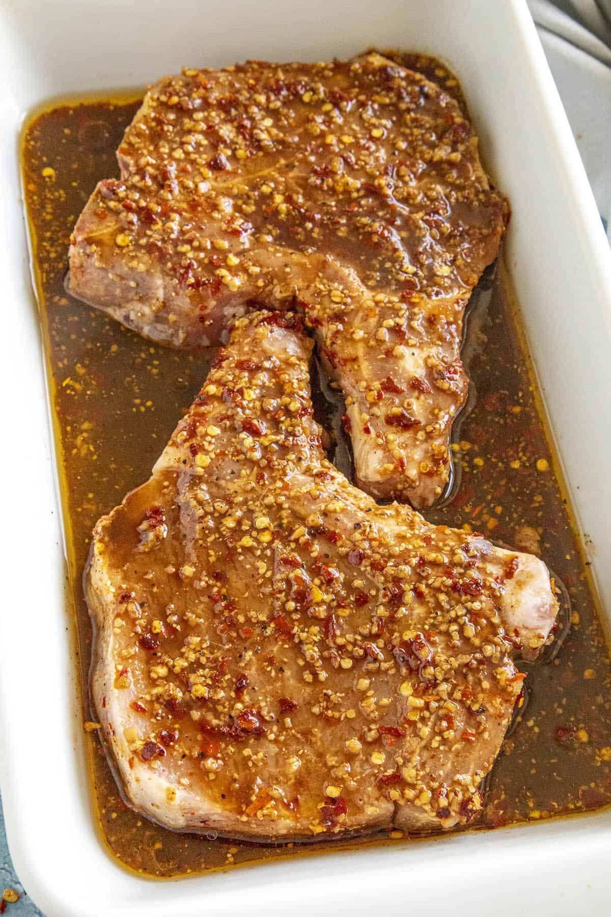 Pork chops marinating in my perfect pork chop marinade recipe