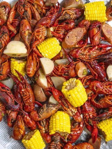 Serving up a large Crawfish Boil on a newspaper lined table