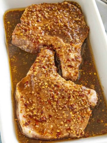 Pork chops marinating in my perfect pork chop marinade recipe