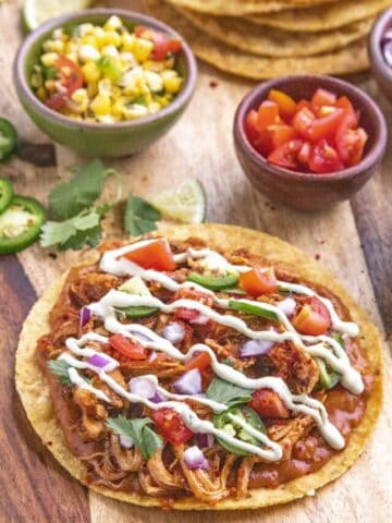 Chicken Tinga Tostadas with avocado crema