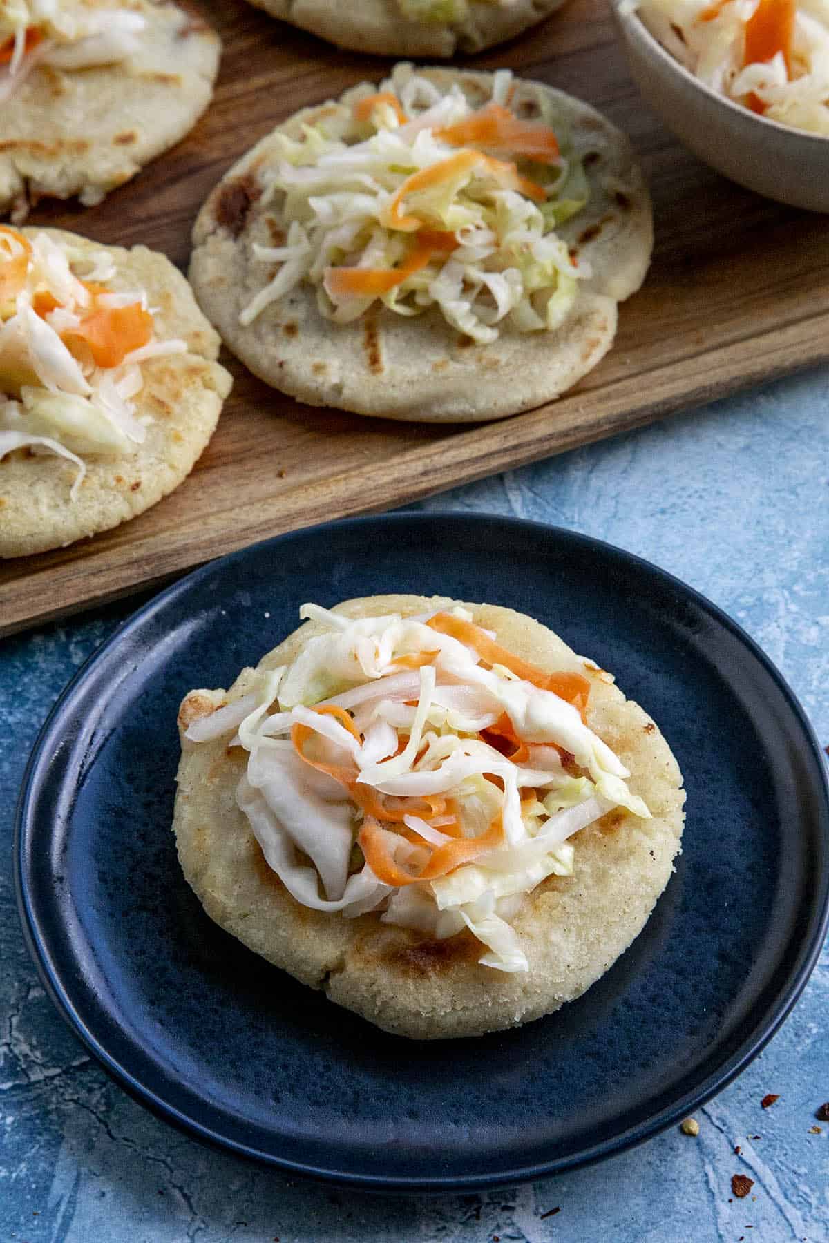 Curtido (Salvadoran Cabbage Slaw) on a Salvadoran pupusa