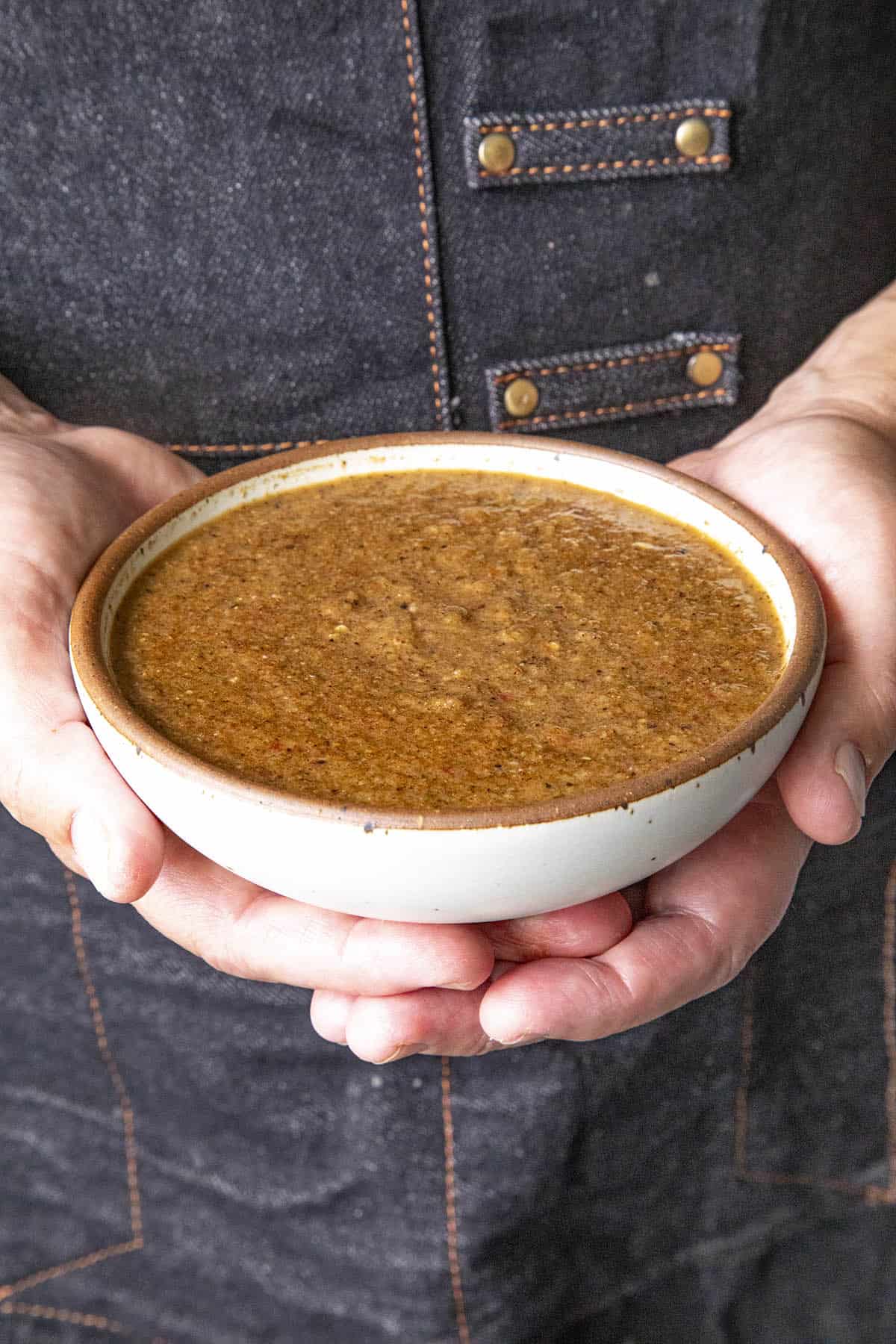 Mike holding a bowl of Jamaican Jerk Sauce