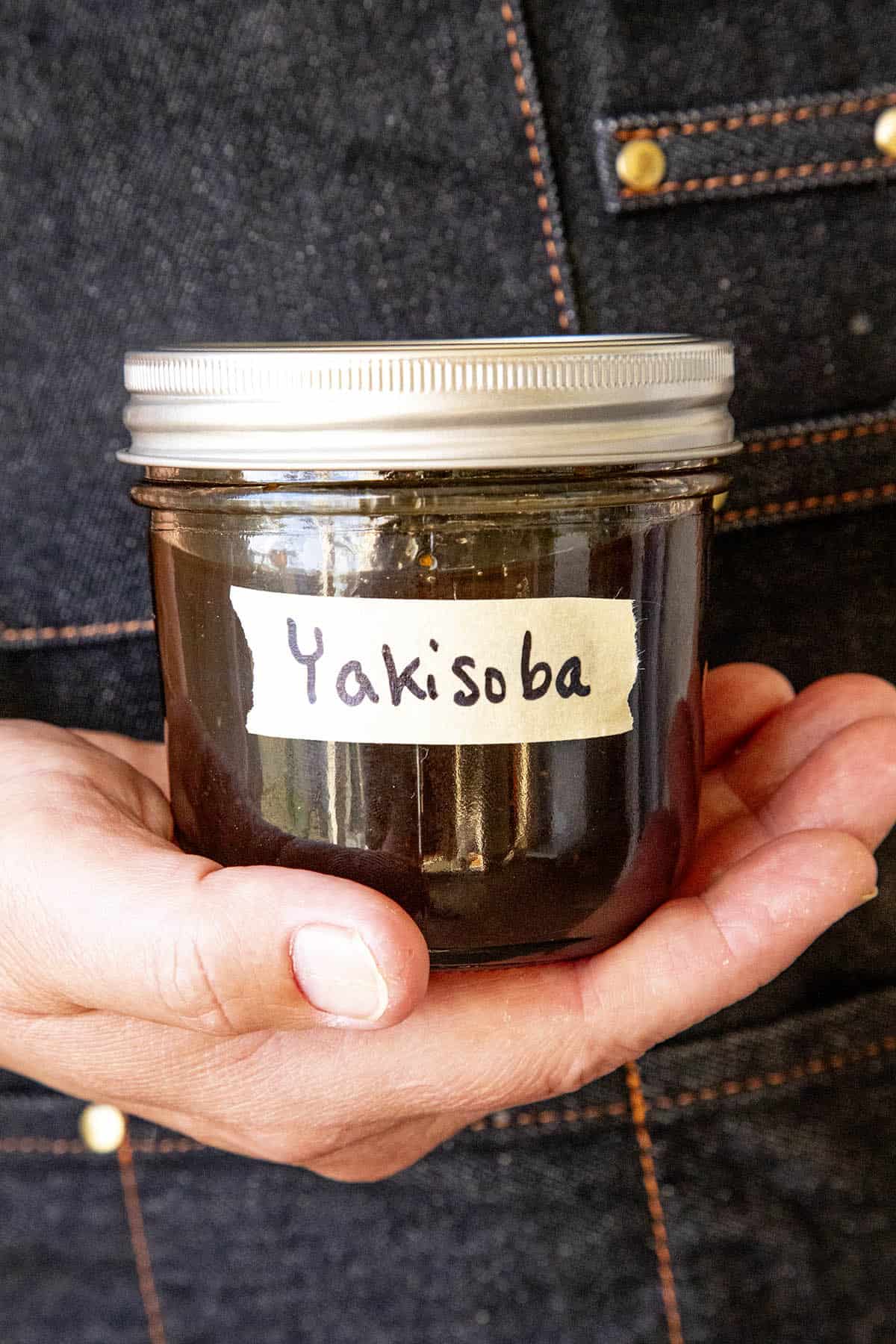 Mike holding a jar of Yakisoba Sauce