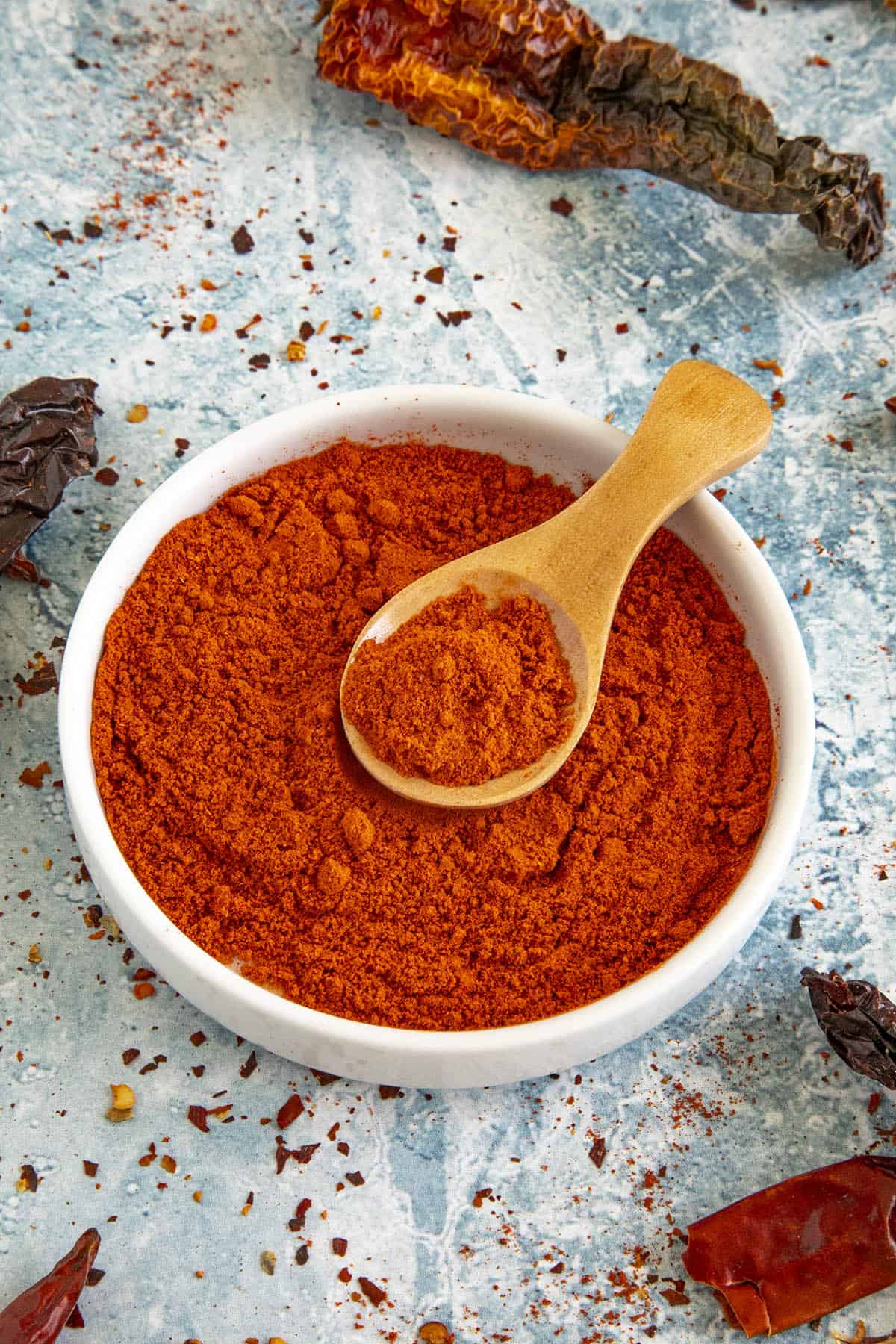 Homemade berbere seasoning in a bowl with a spoon