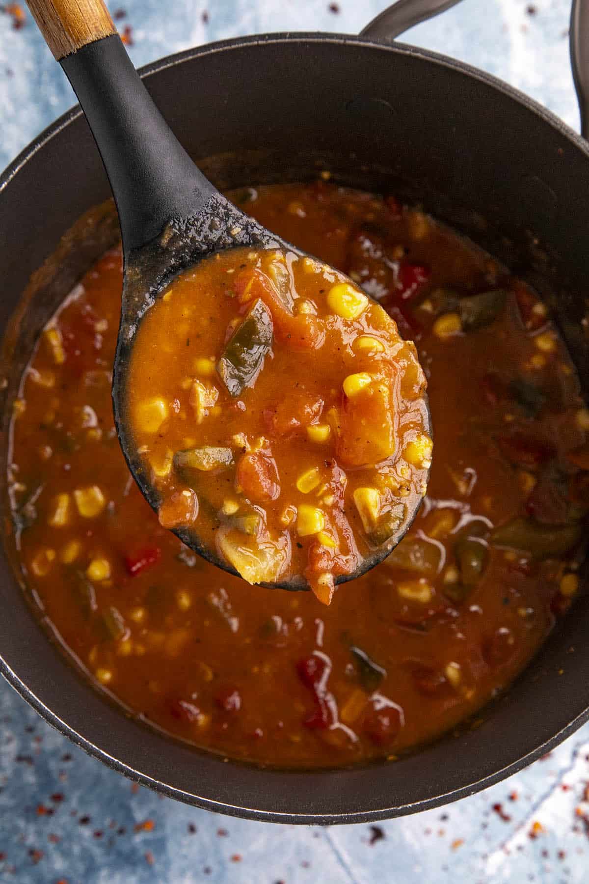 Mike serving Creole Tomato and Shrimp Stew from the pot