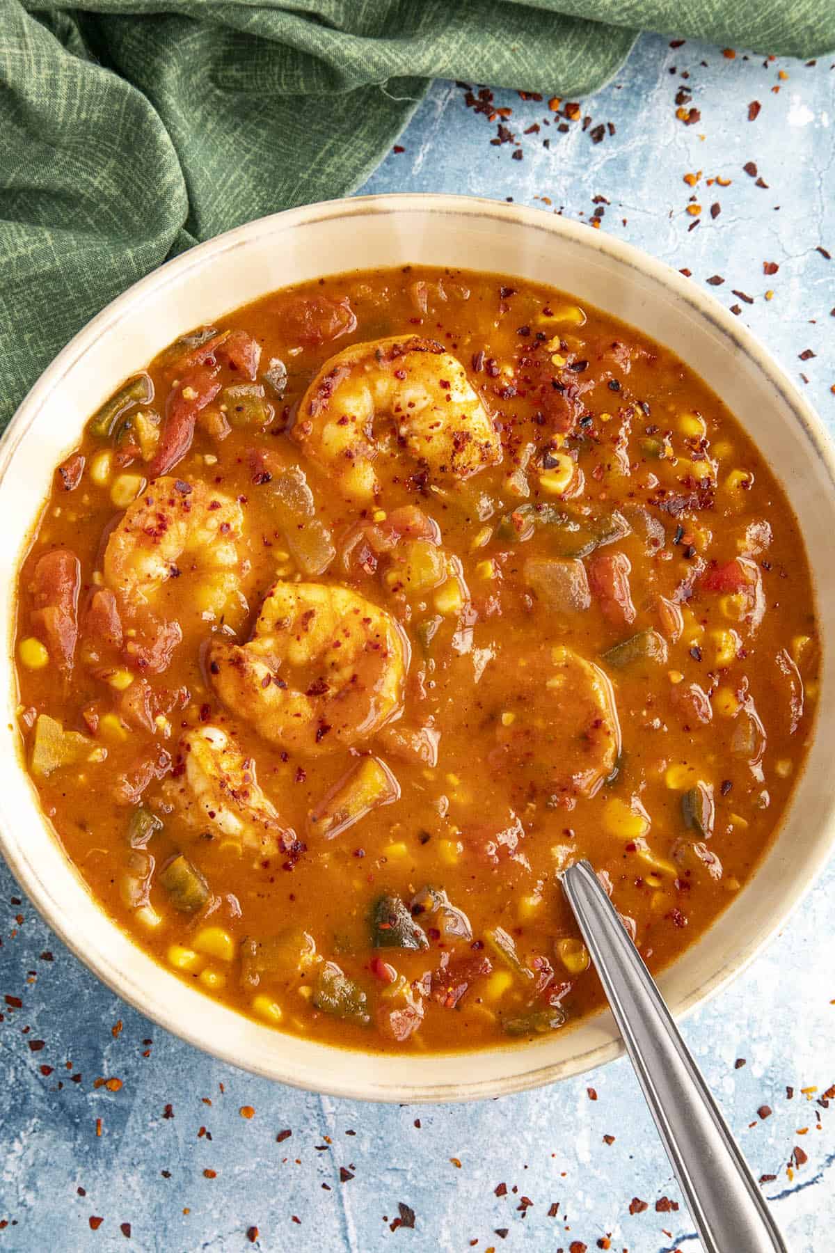 Creole Tomato and Shrimp Stew in a bowl with a spoon