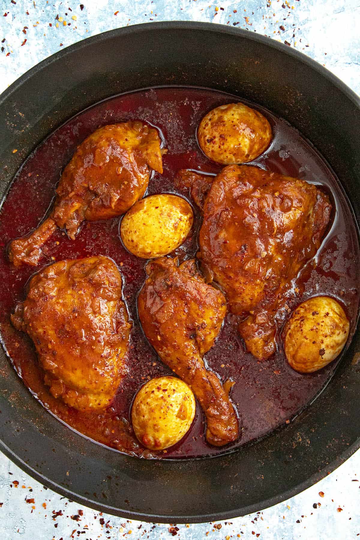 Doro Wat (Ethiopian Chicken Stew) simmering in a pot, ready to serve.