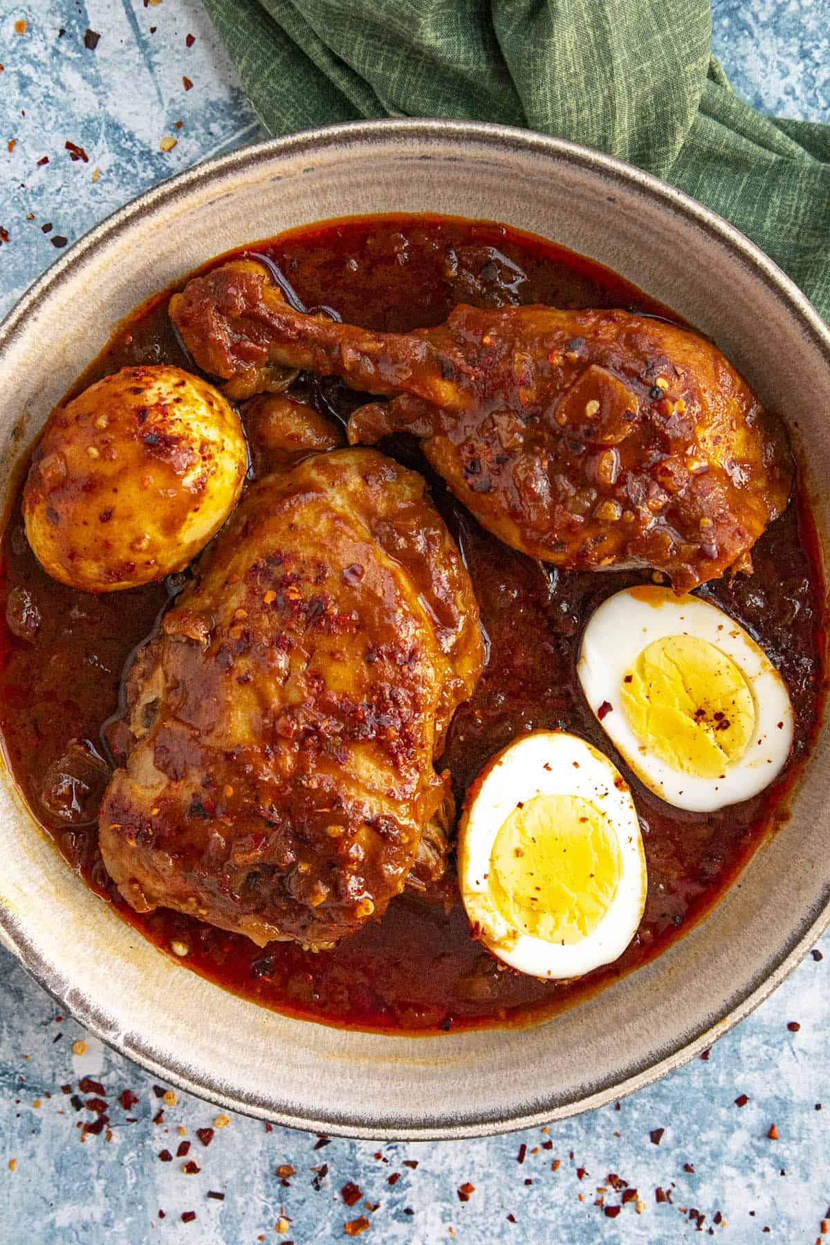 Doro Wat (Ethiopian Chicken Stew) in a bowl with sliced hard boiled eggs.