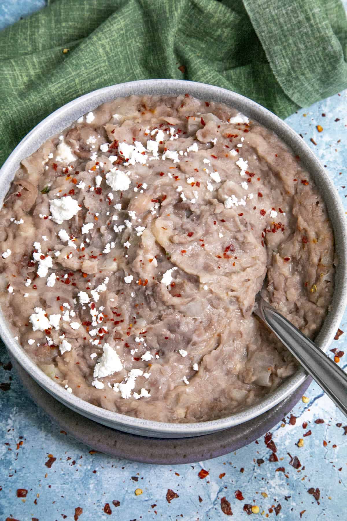 Homemade Refried Bean in a bowl with a spoon