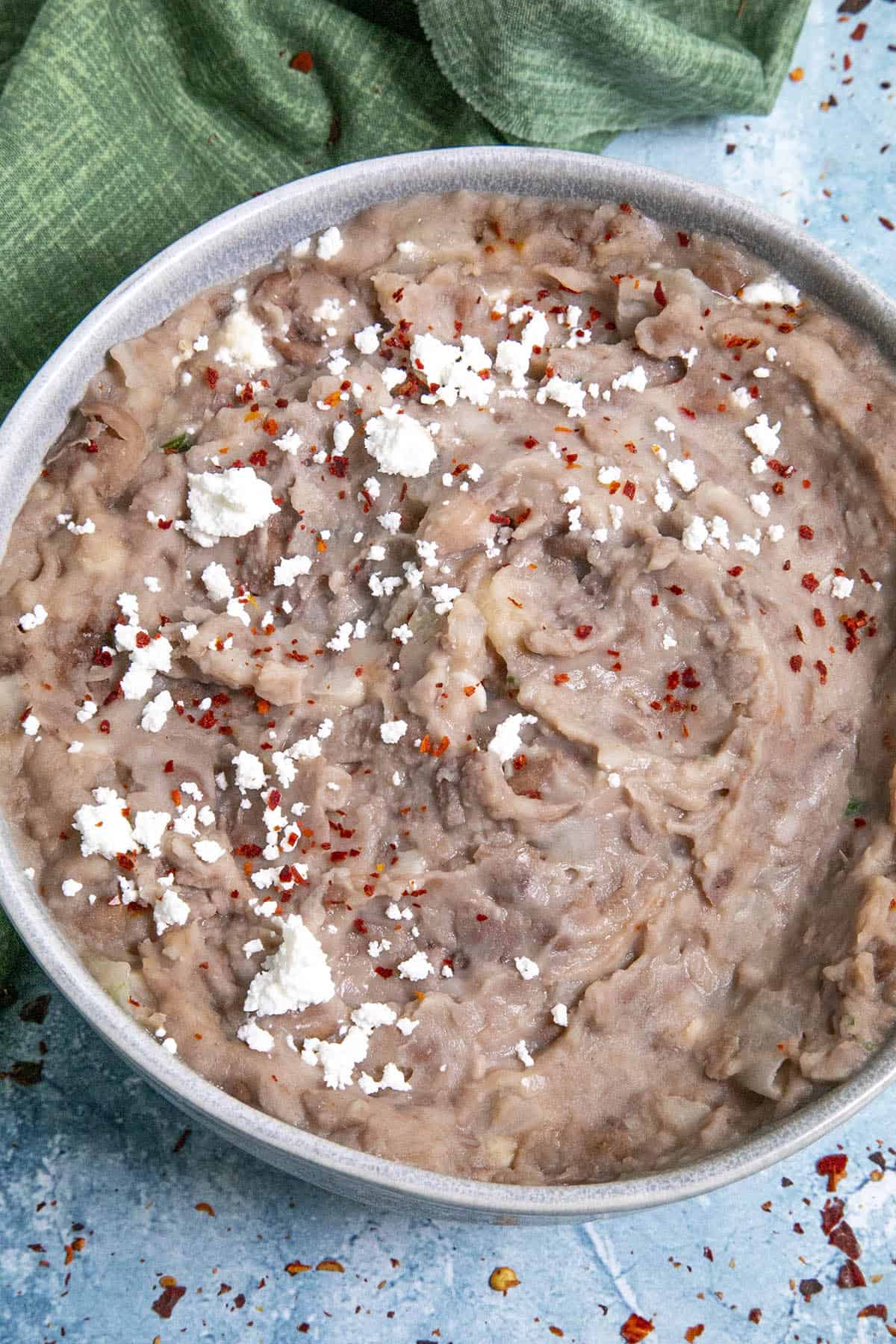 Homemade Refried Bean in a bowl with queso fresco