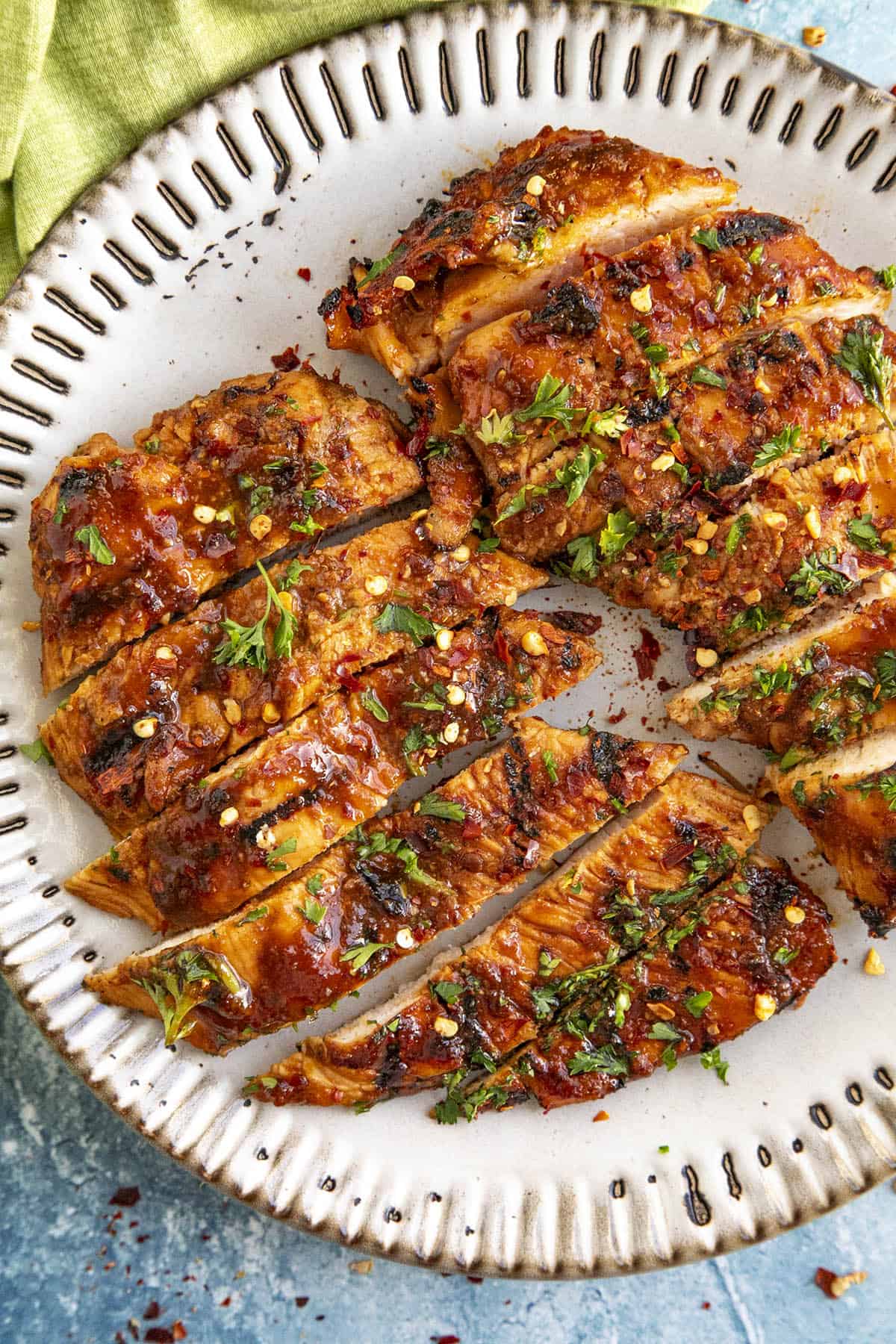 Sliced Honey Sriracha Chicken on a plate