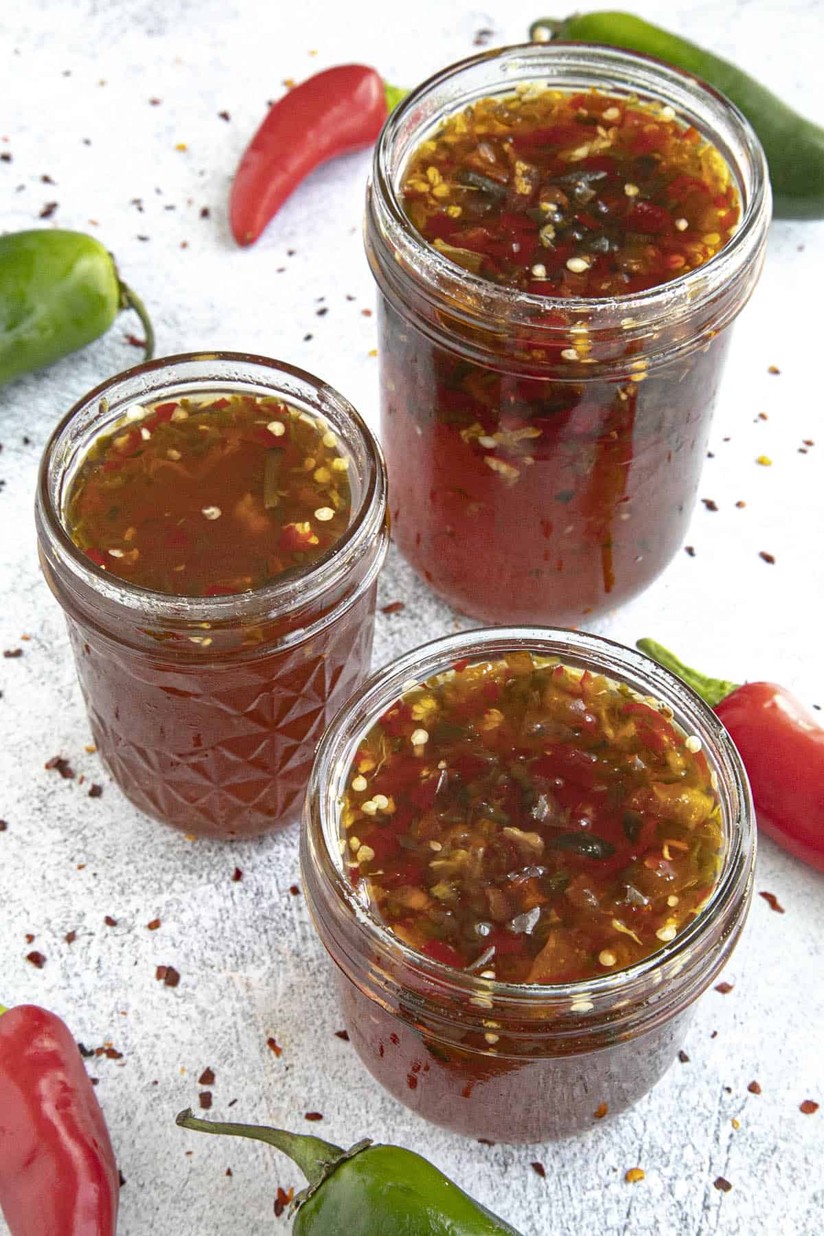 3 Jars of Spicy Pepper Jelly on a Table