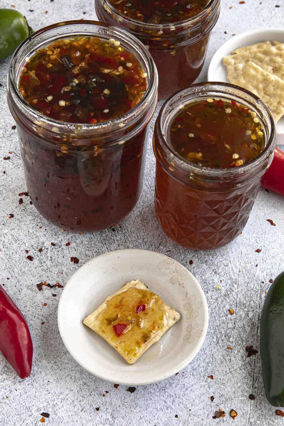 Pepper Jelly in jars and on a cracker