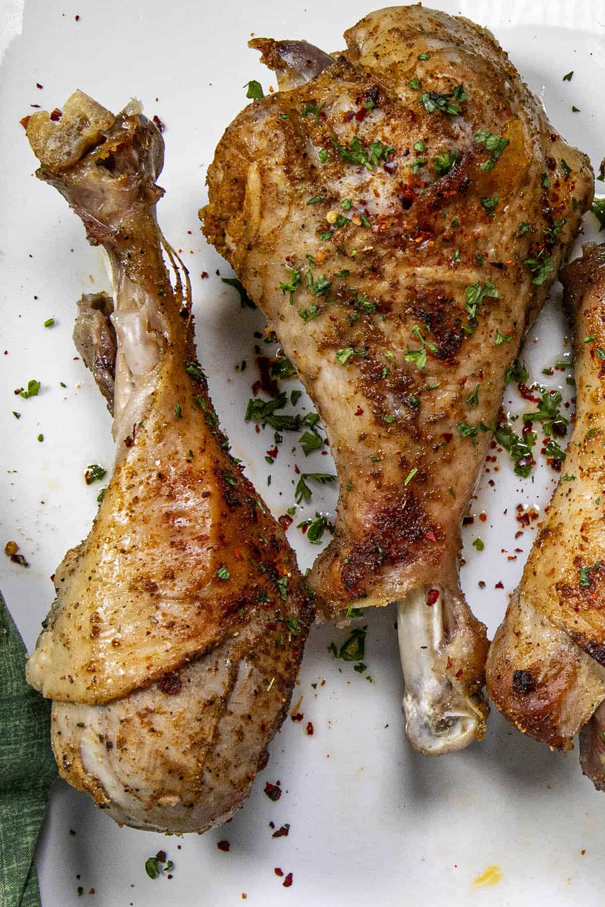 Plump and juicy Roasted Turkey Legs on a platter