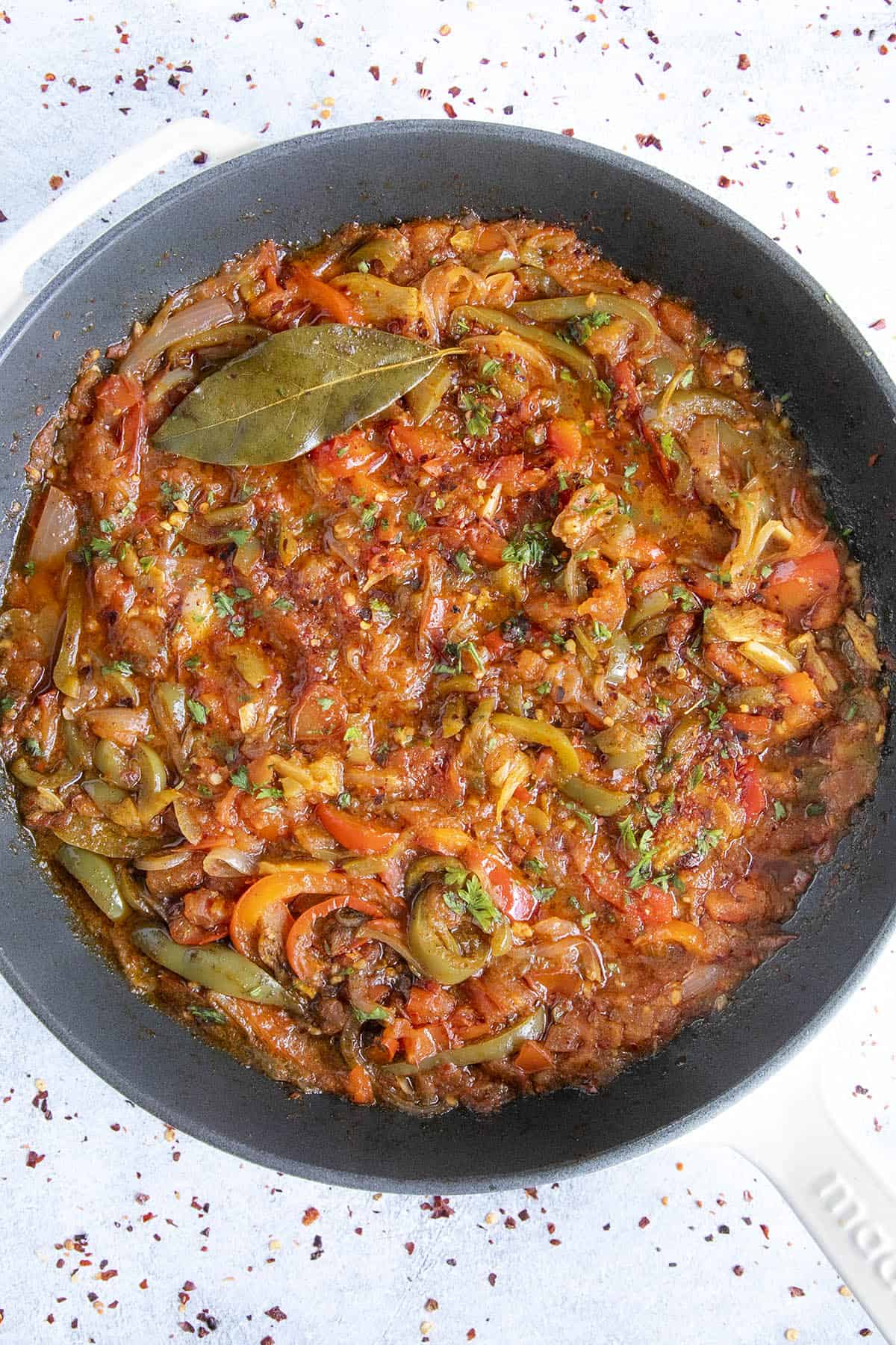 Piperade (Basque Tomato-Pepper Sauce) stewing in a pan