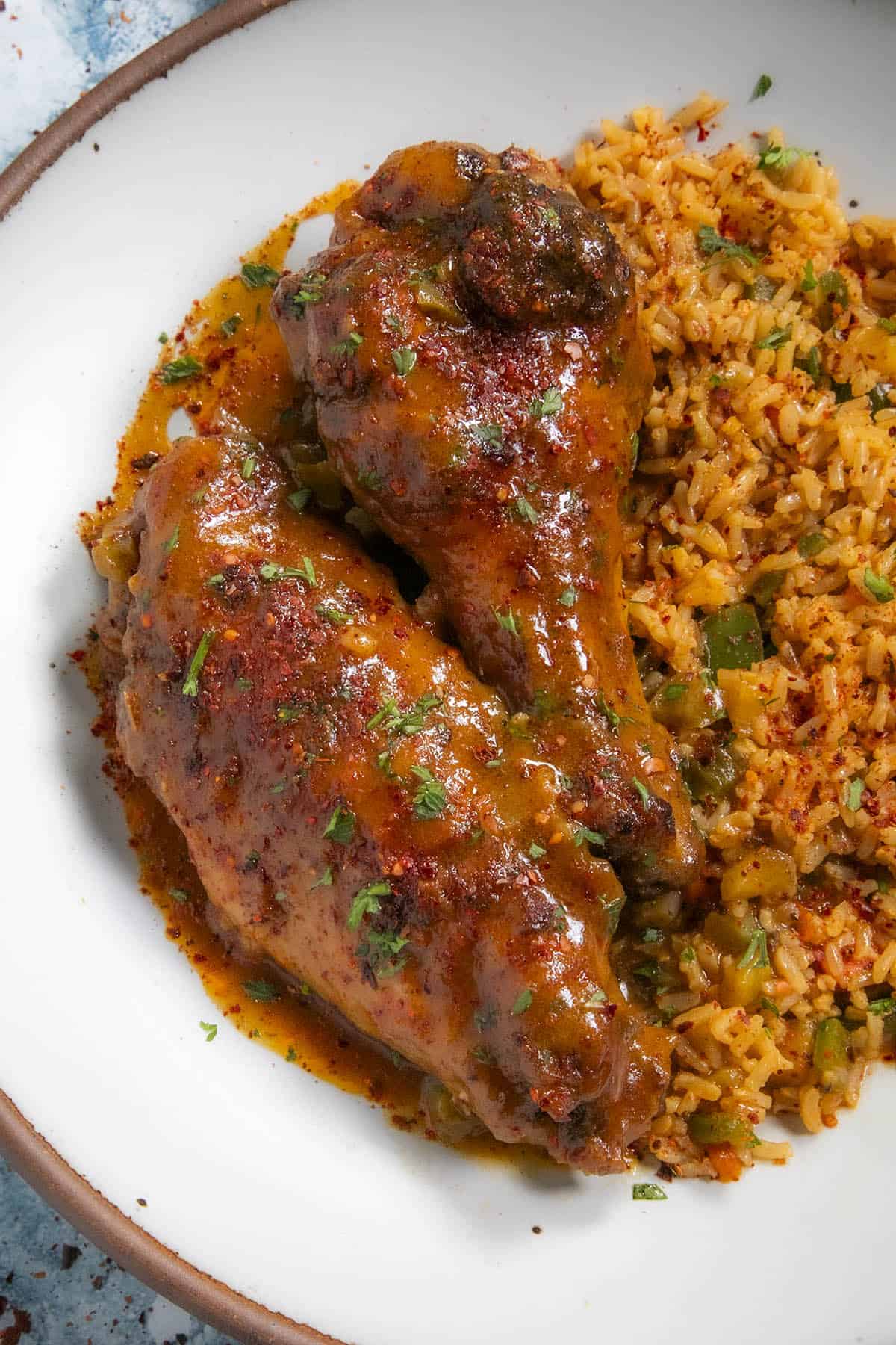 Two Smothered Turkey Wings served over a bed of rice