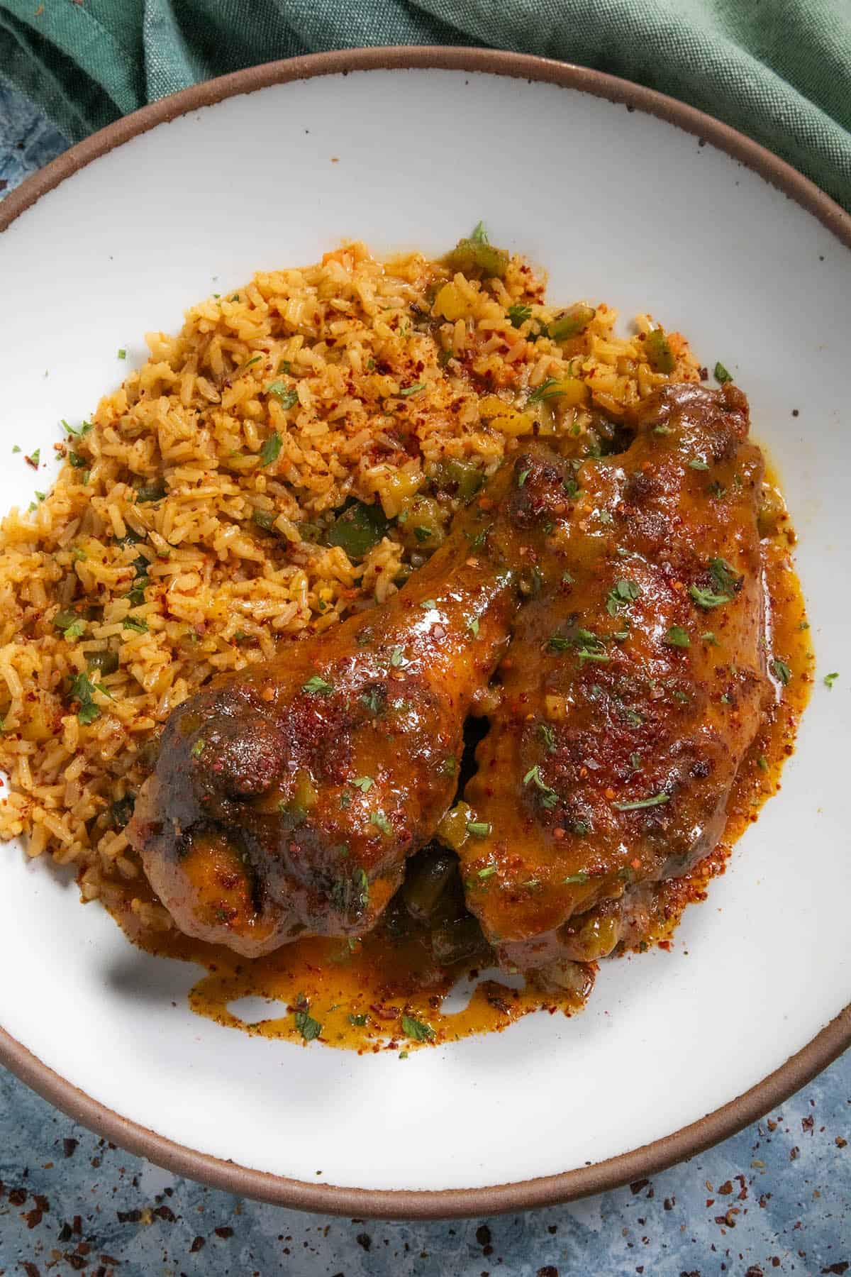 Serving Smothered Turkey Wings in a bowl over rice