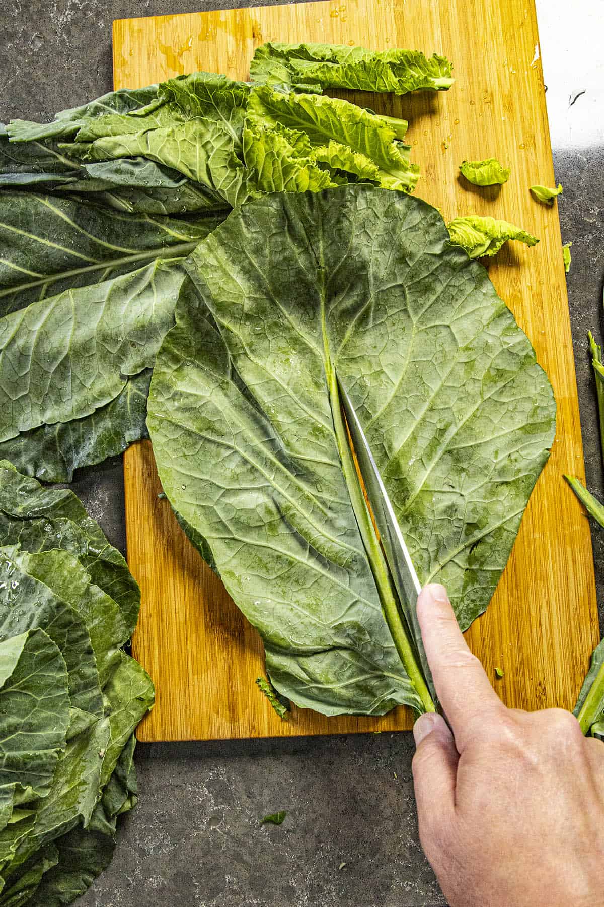 Slicing the stems from Collard Greens