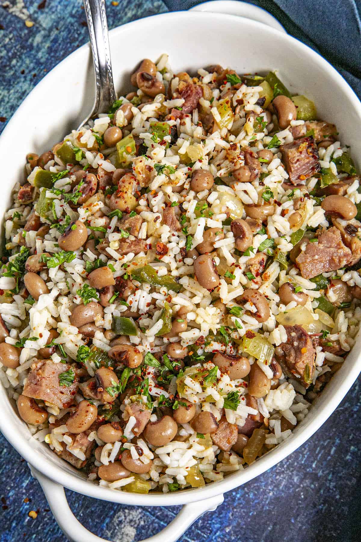 Hoppin John in a serving bowl mixed with rice