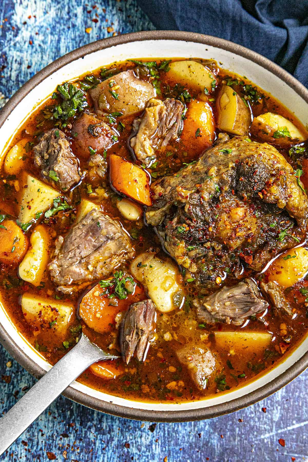 Oxtail Soup in a bowl with a spoon