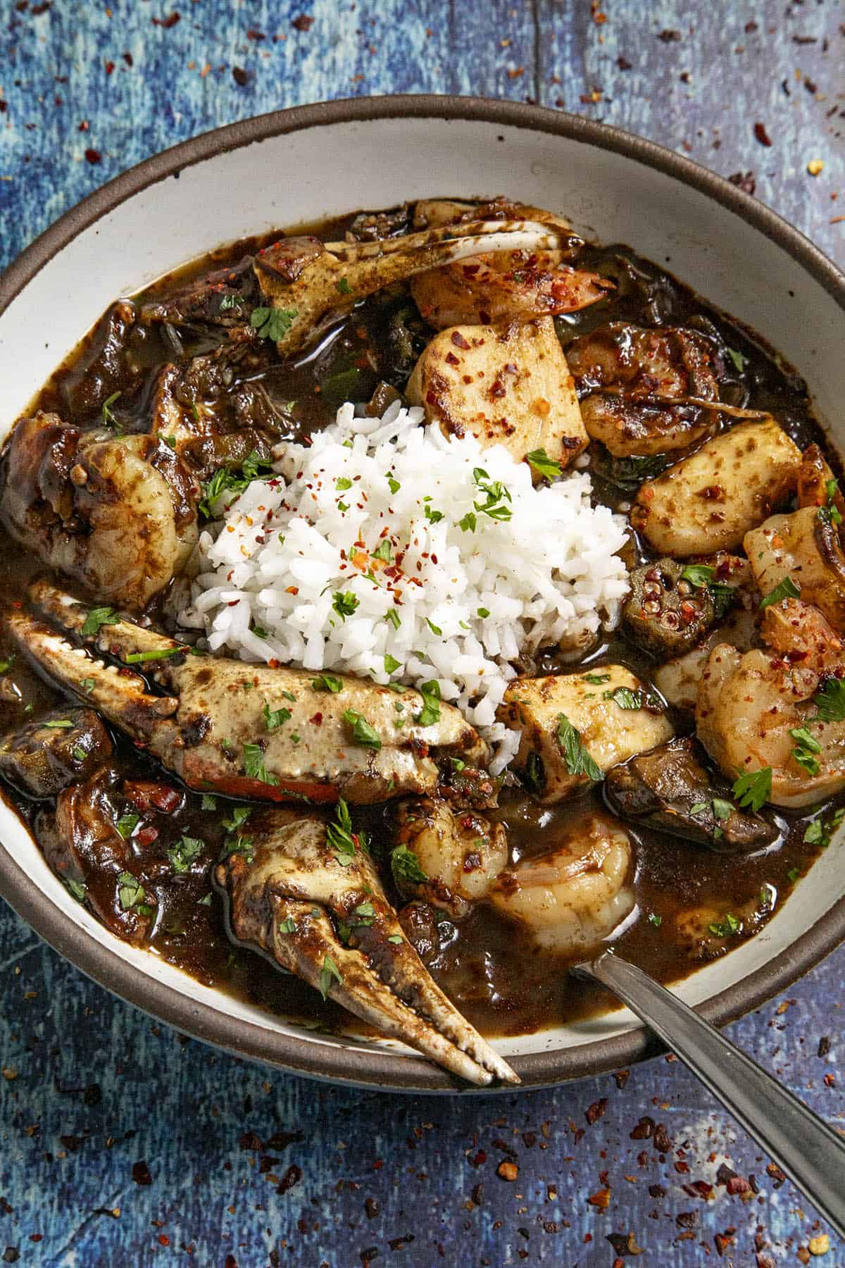 A bowl of Seafood Gumbo with rice on top