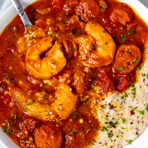 Mike taking a spoonful of Shrimp and Grits