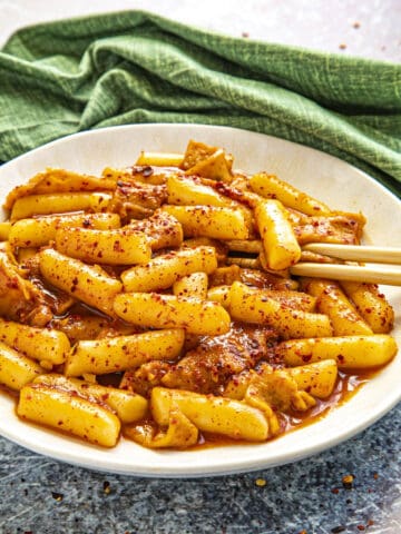 Tteokbokki in a bowl with extra chili flakes