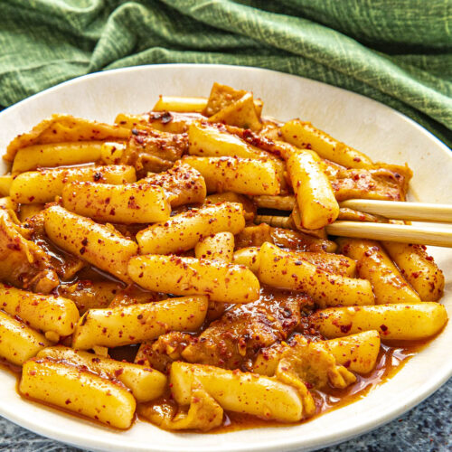Tteokbokki in a bowl with extra chili flakes