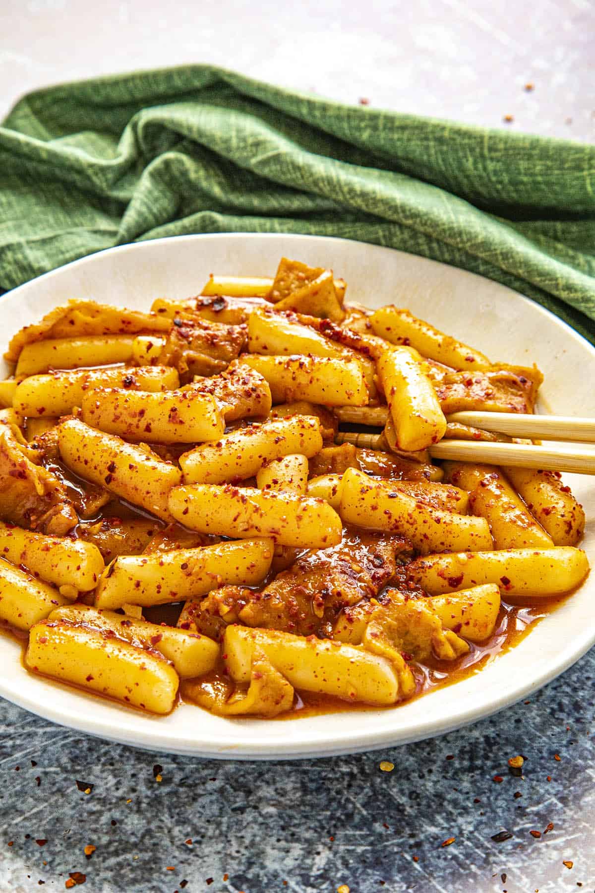 Tteokbokki in a bowl with extra chili flakes