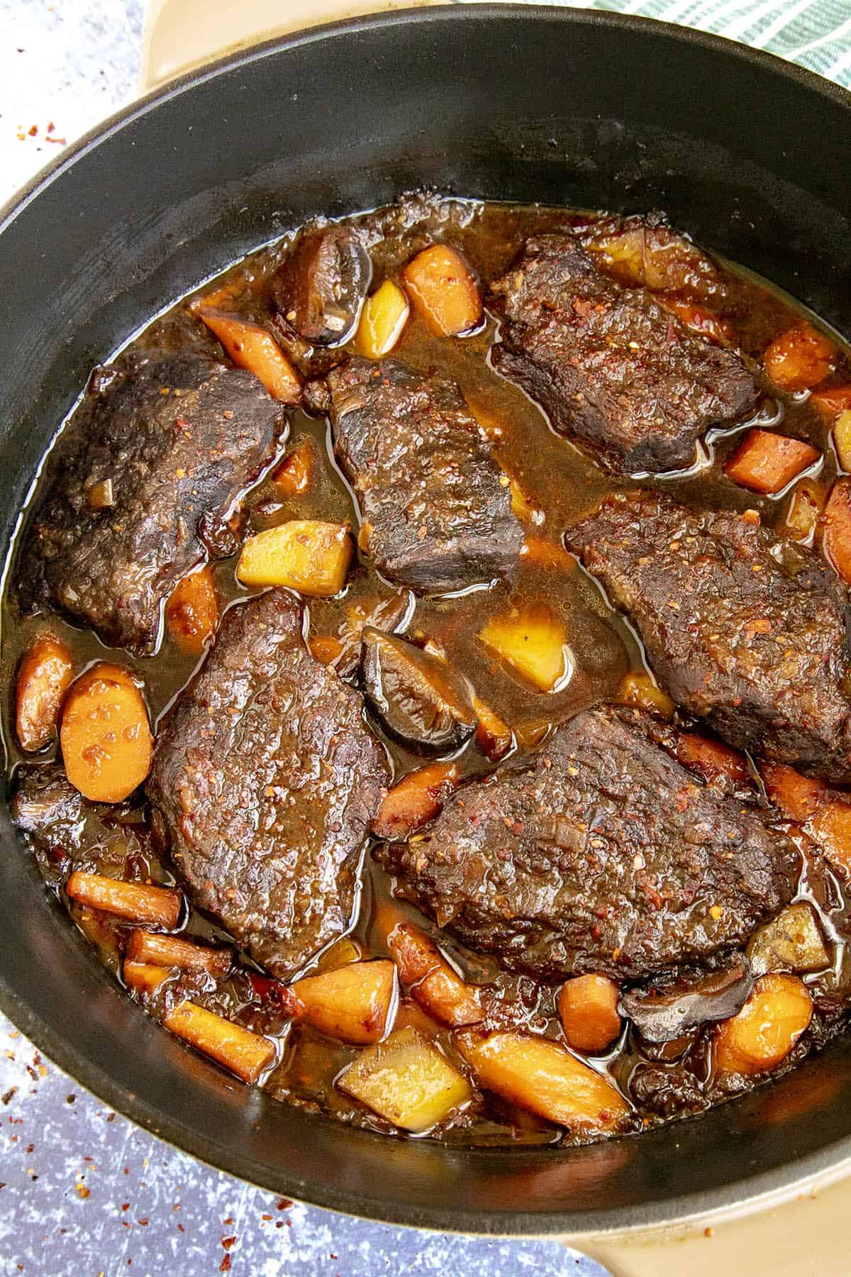 Galbi Jjim (Korean Braised Short Ribs) stewing in a pot with lots of meat and vegetables