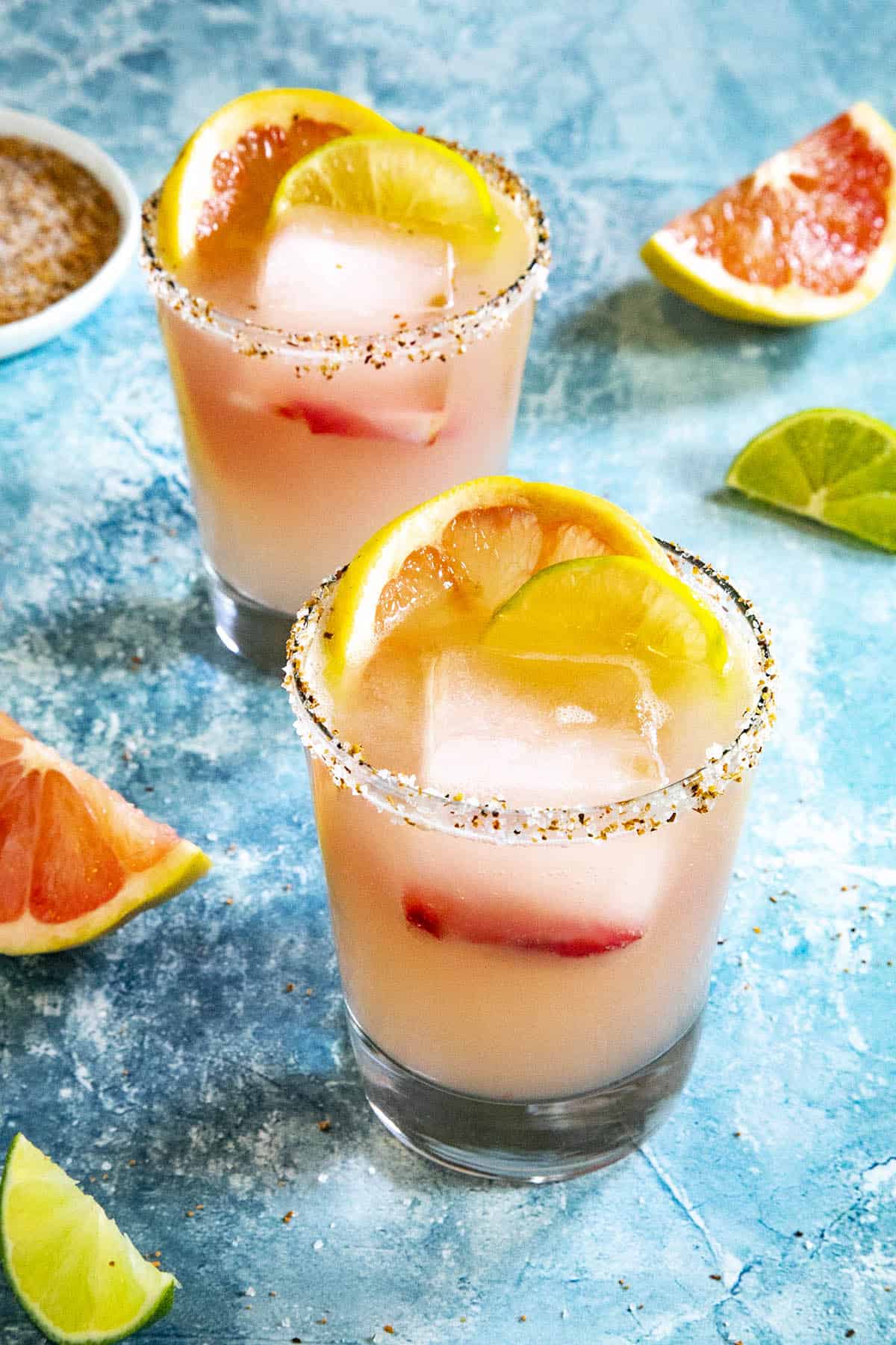 A paloma drink in a cocktail glass with ice