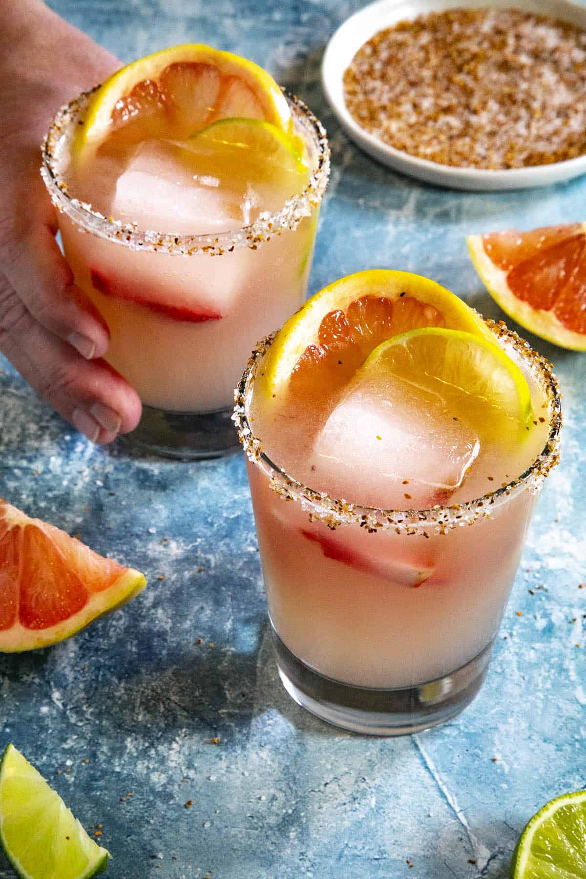 Mike taking a paloma drink in a cocktail glass