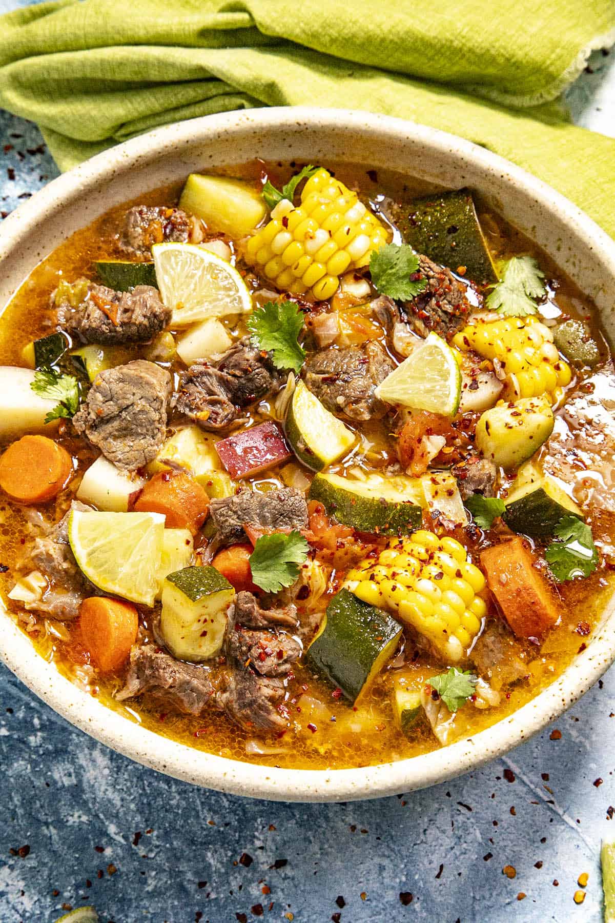 Caldo de Res (Mexican Beef Soup) in a bowl with lots of meat and vegetables