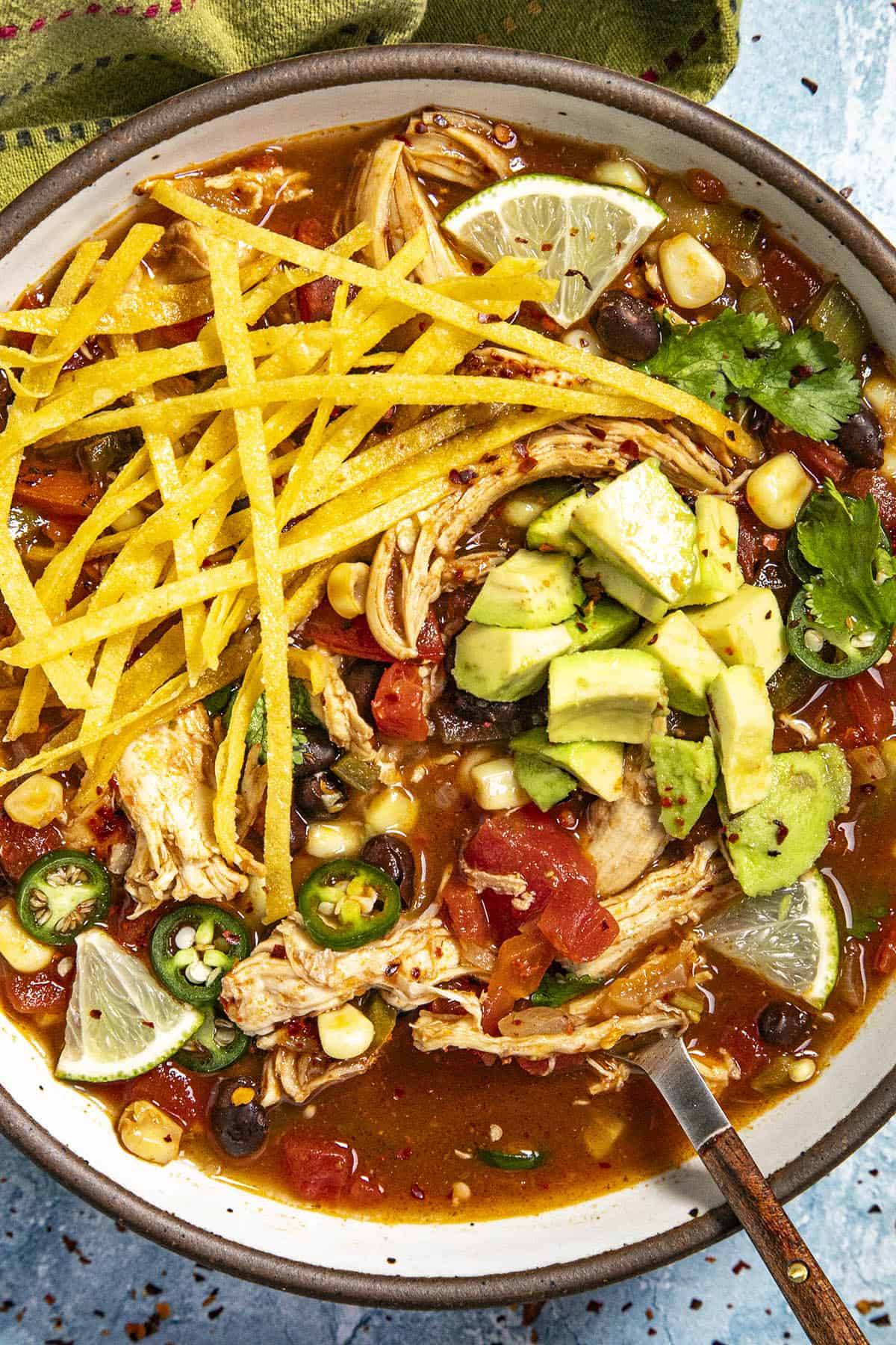 Chicken Tortilla Soup in a bowl with crispy tortilla strips