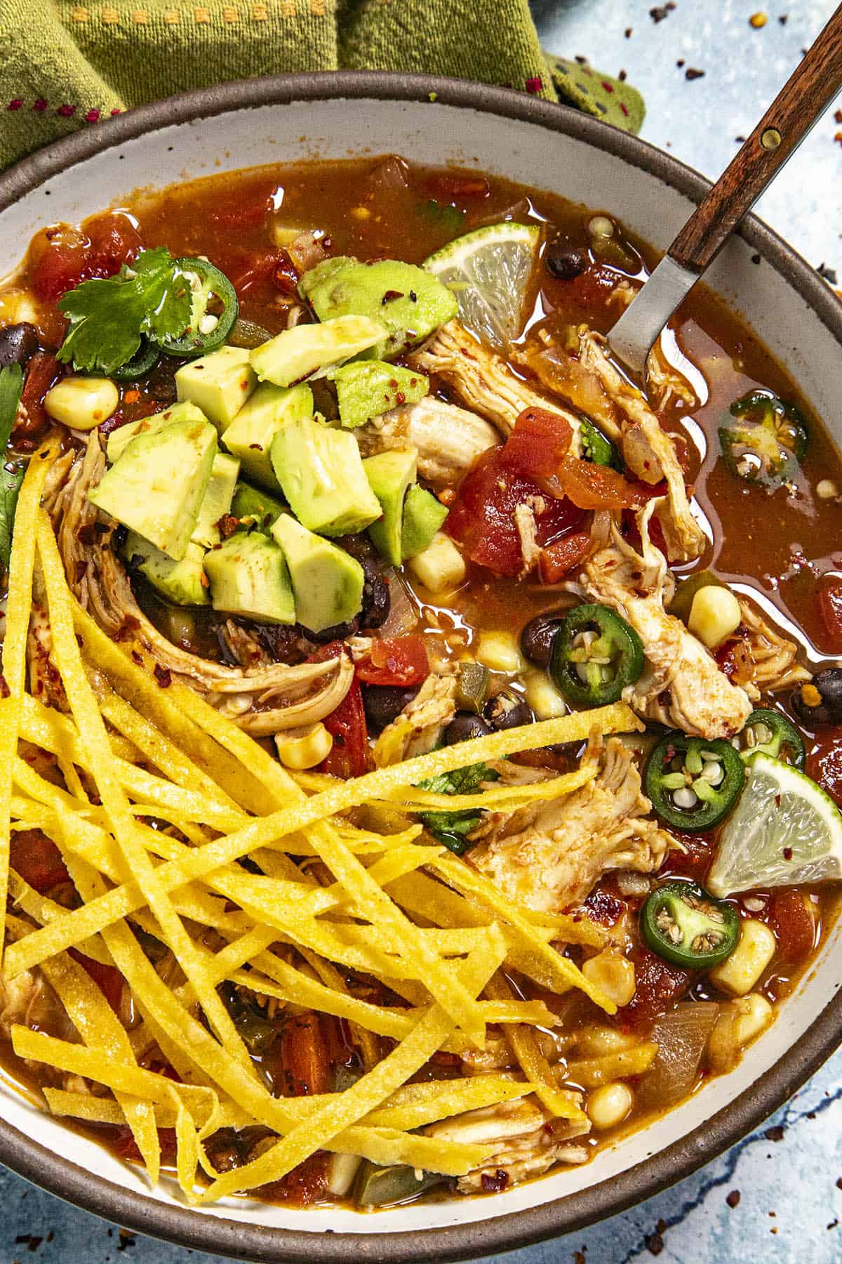 Chicken Tortilla Soup in a bowl with lots of garnish