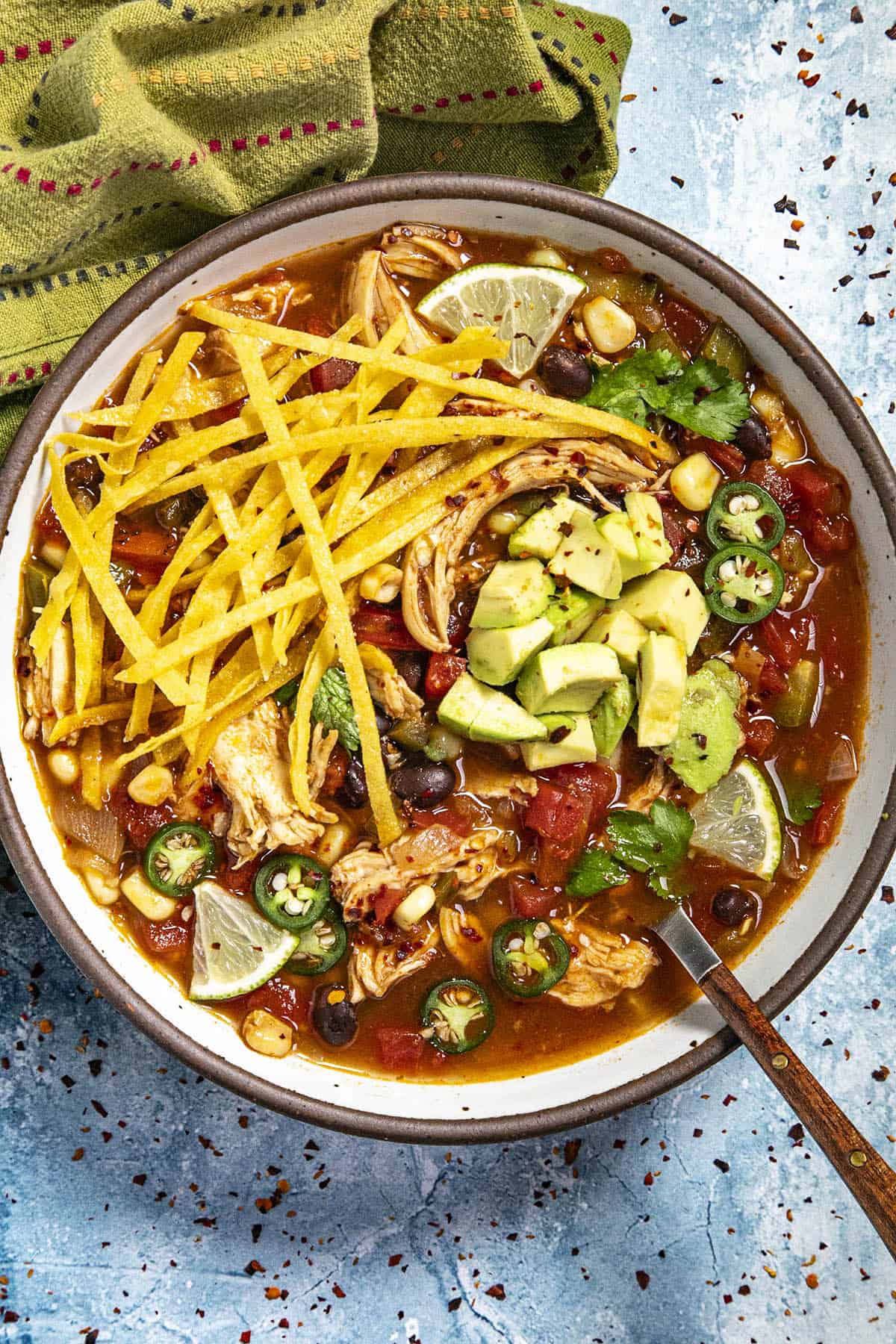 Chicken Tortilla Soup in a serving bowl with a spoon