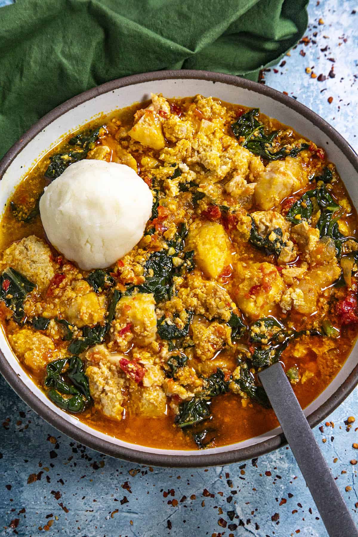 Egusi Soup in a bowl with fufu