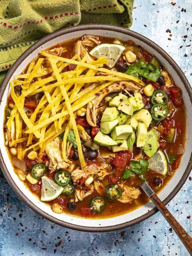 Chicken Tortilla Soup in a serving bowl with a spoon