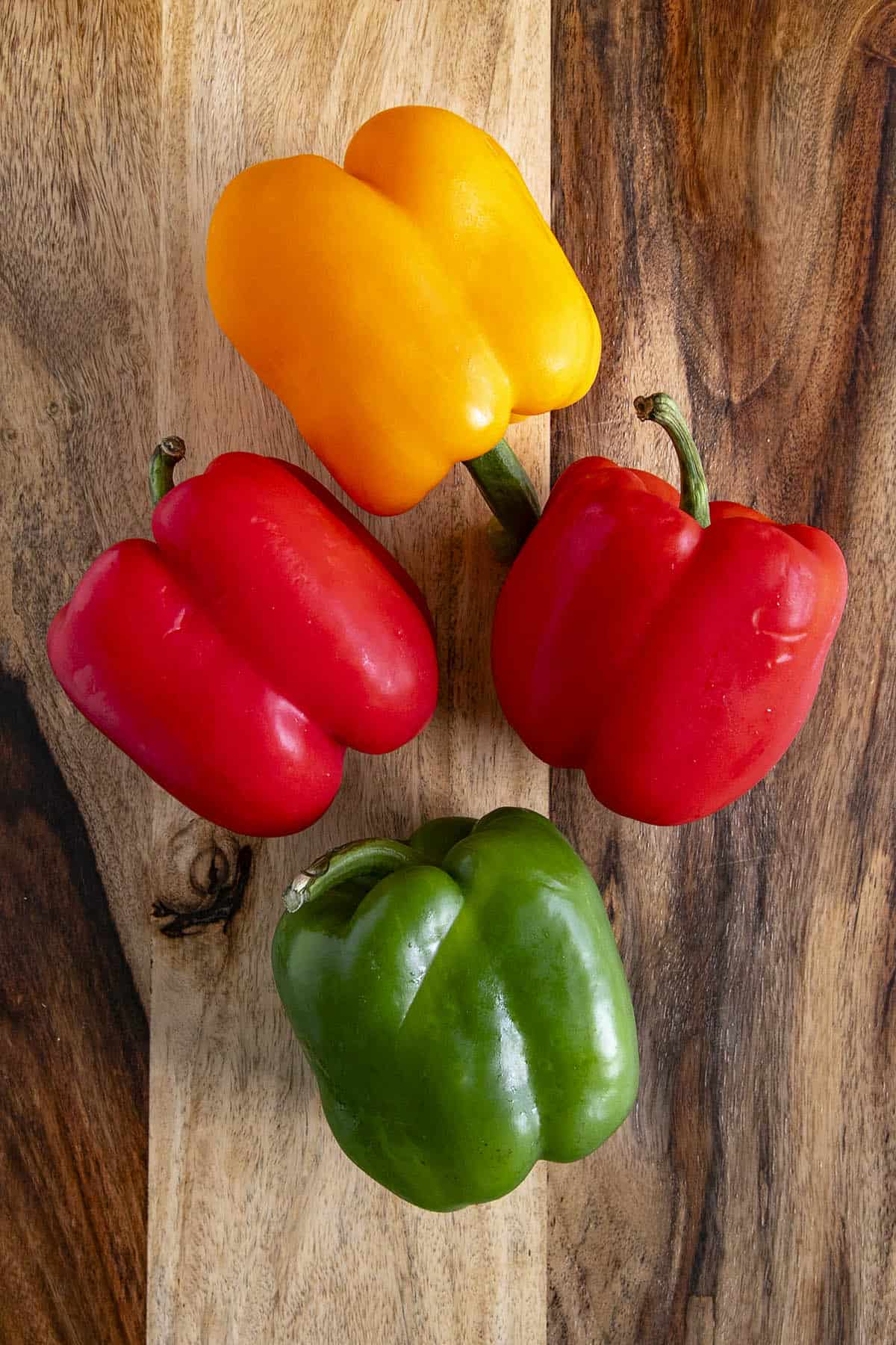 4 colorful Bell Peppers on a table