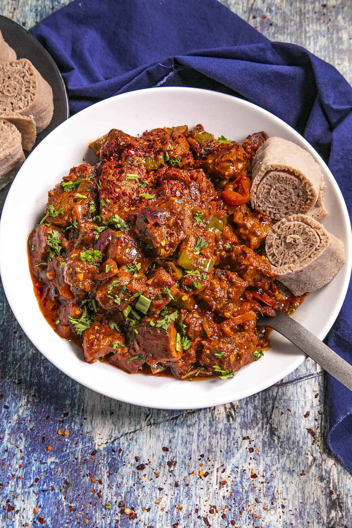 Ethiopian Awaze Tibs in a bowl with injera bread