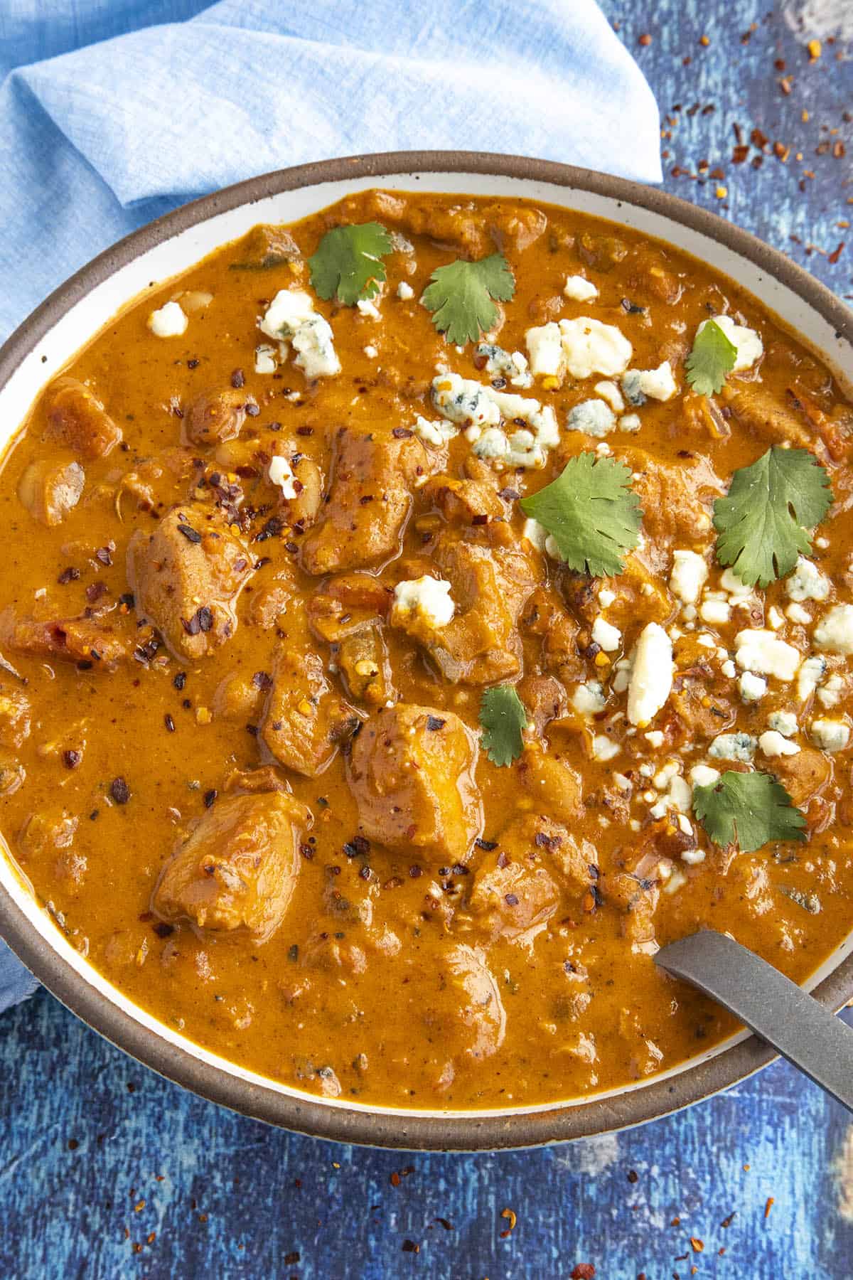 Creamy Buffalo Chicken Chili in a bowl, topped with crumbled blue cheese