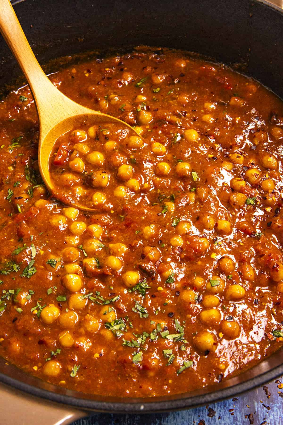 Mike scooping Chana Masala from the pot