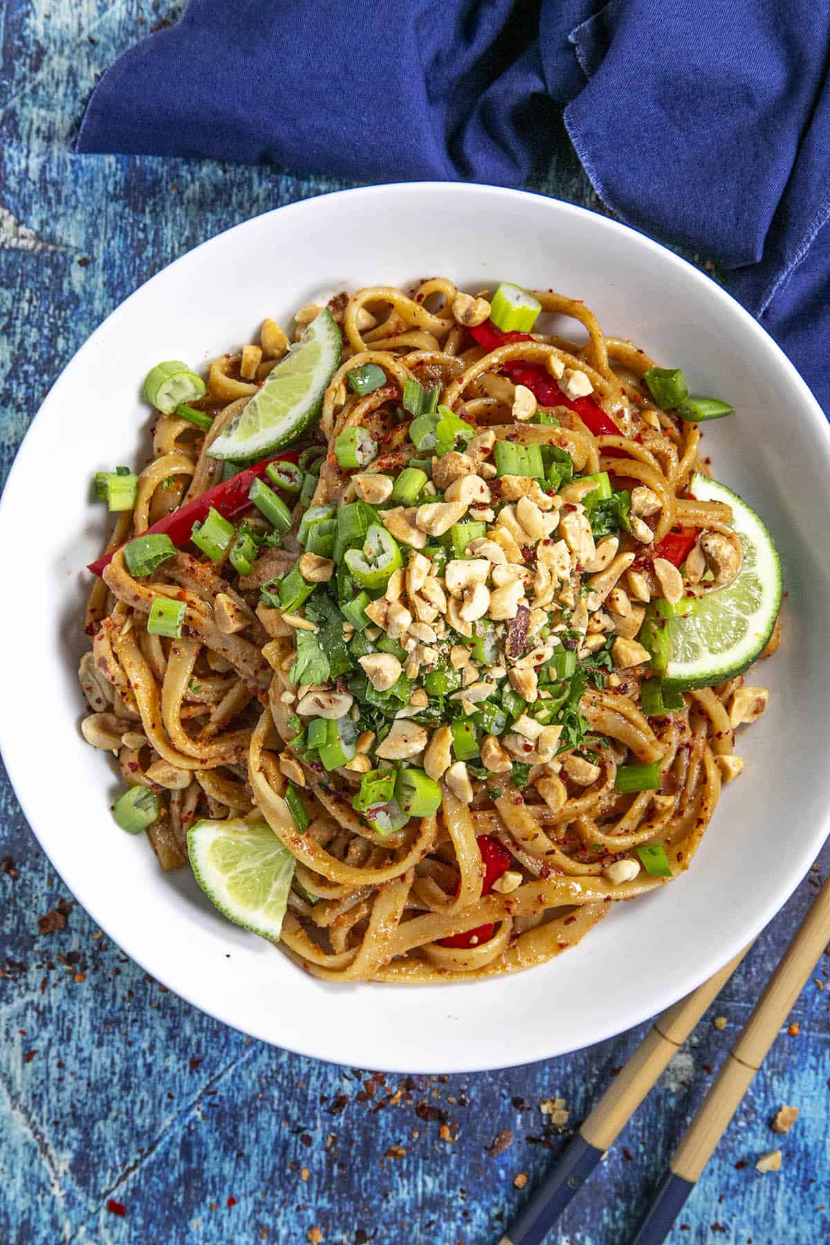 Spicy Thai Peanut Noodles in a bowl with lots of garnish