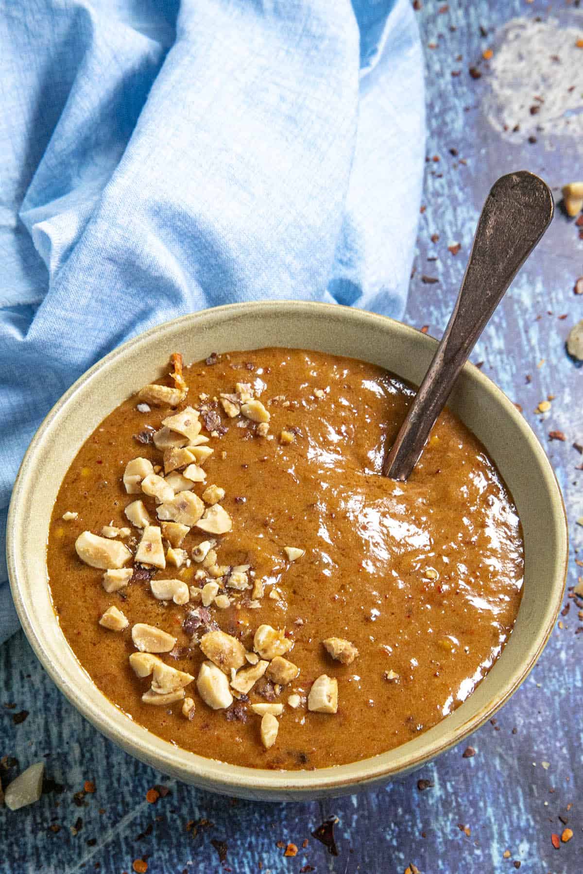 Creamy Thai Peanut Sauce in a bowl with peanuts