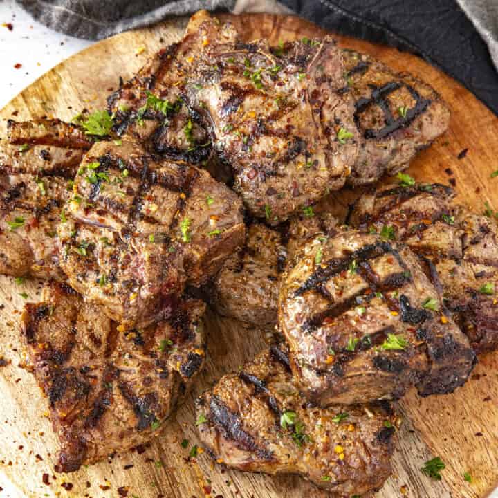 Marinated and grilled lamb chops on a serving platter