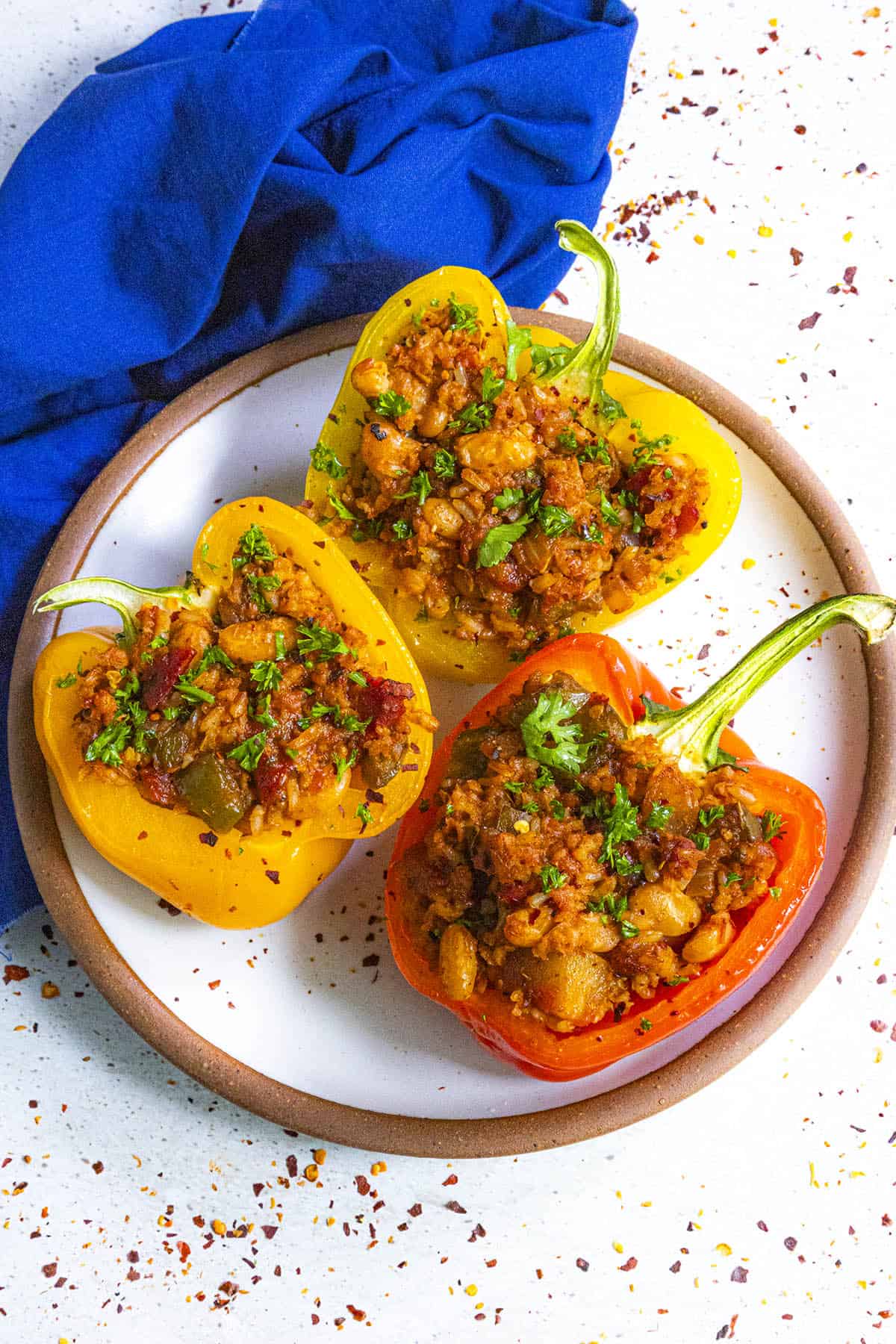 Three Vegan Stuffed Peppers on a serving plate